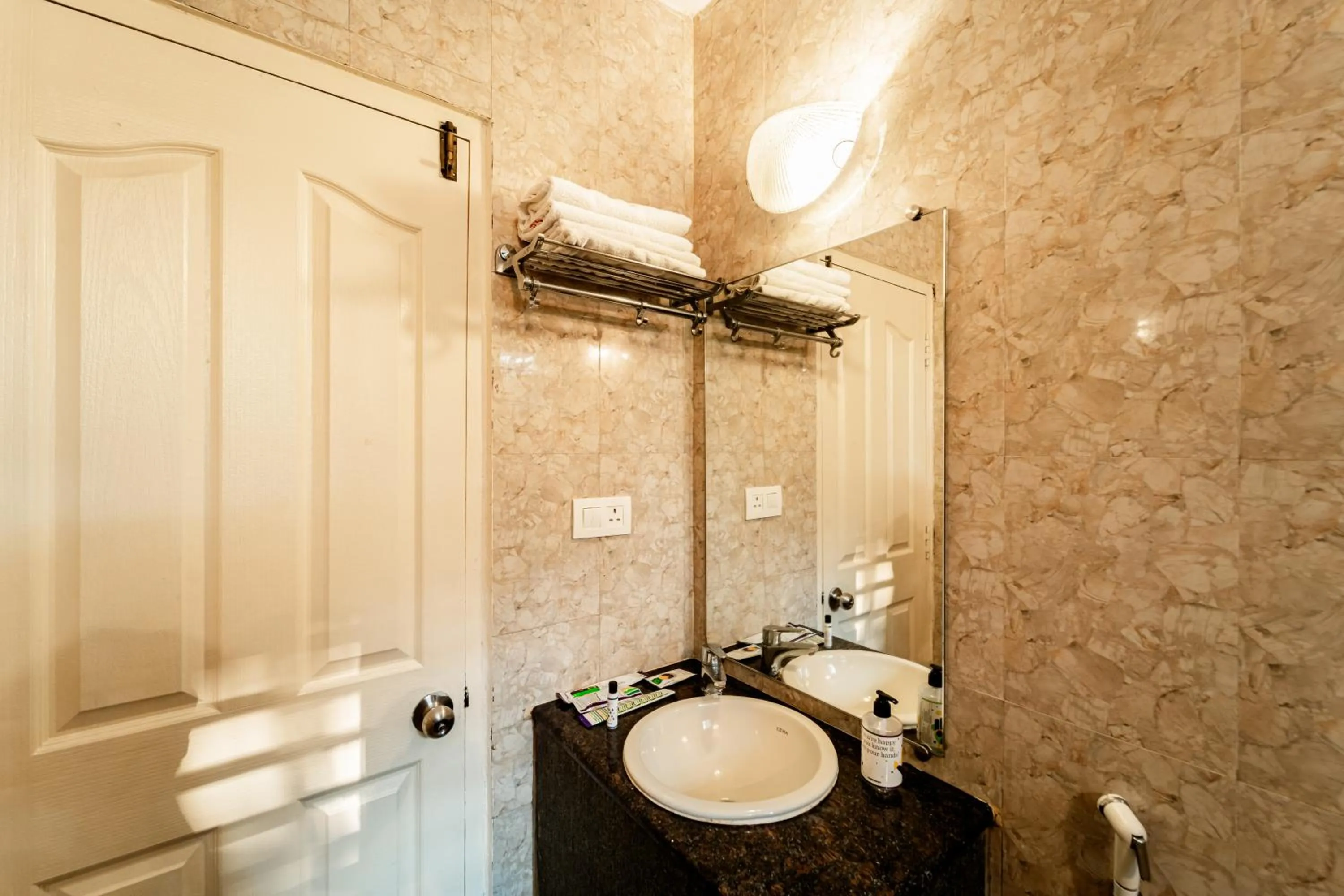 Bathroom in Treebo Gulmohar Beach Resort with Pool