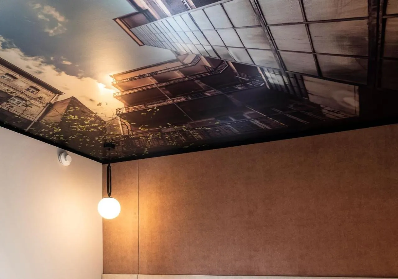 Bedroom in Three Corners Downtown Hotel