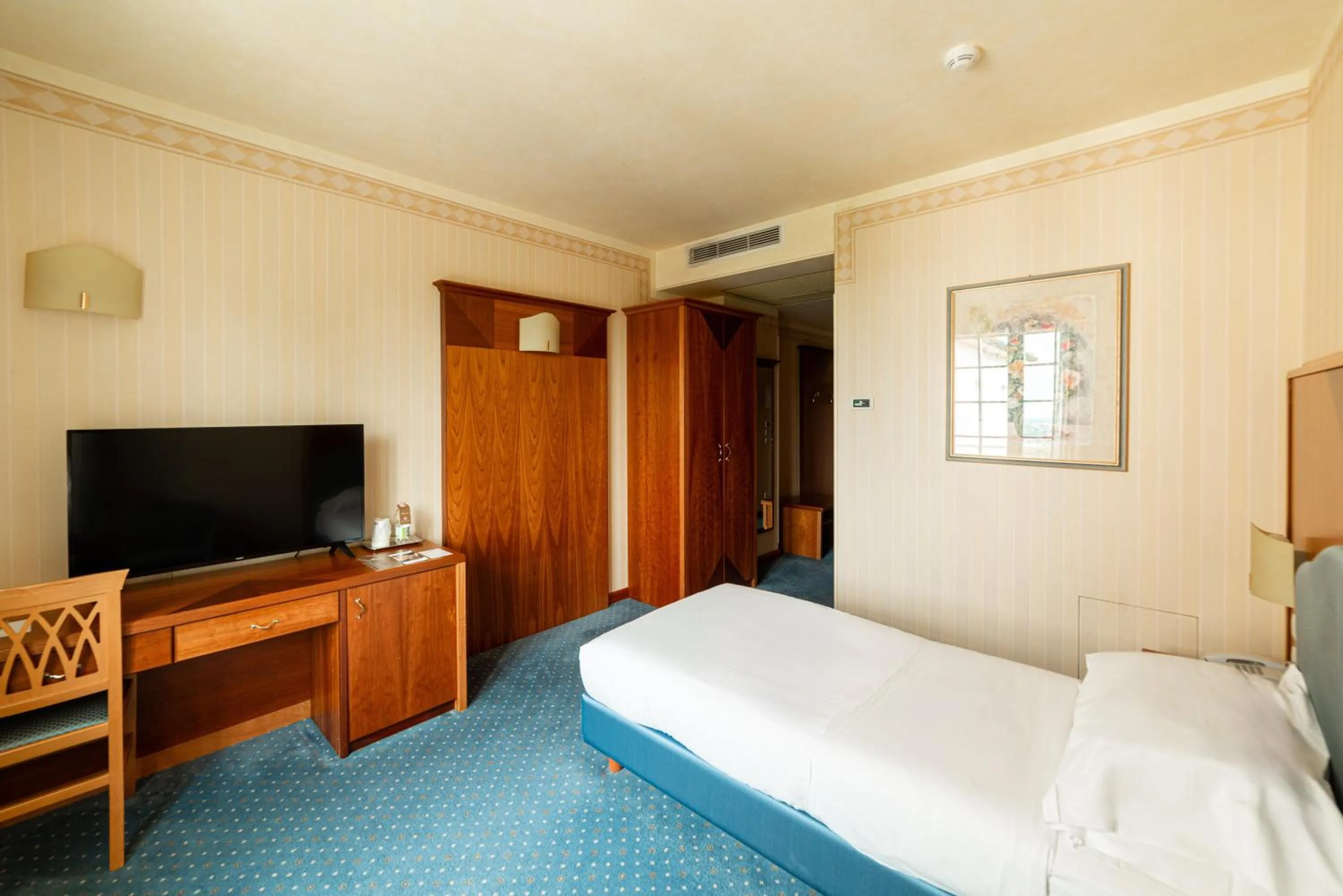 Bed in Phi Hotel Astoria