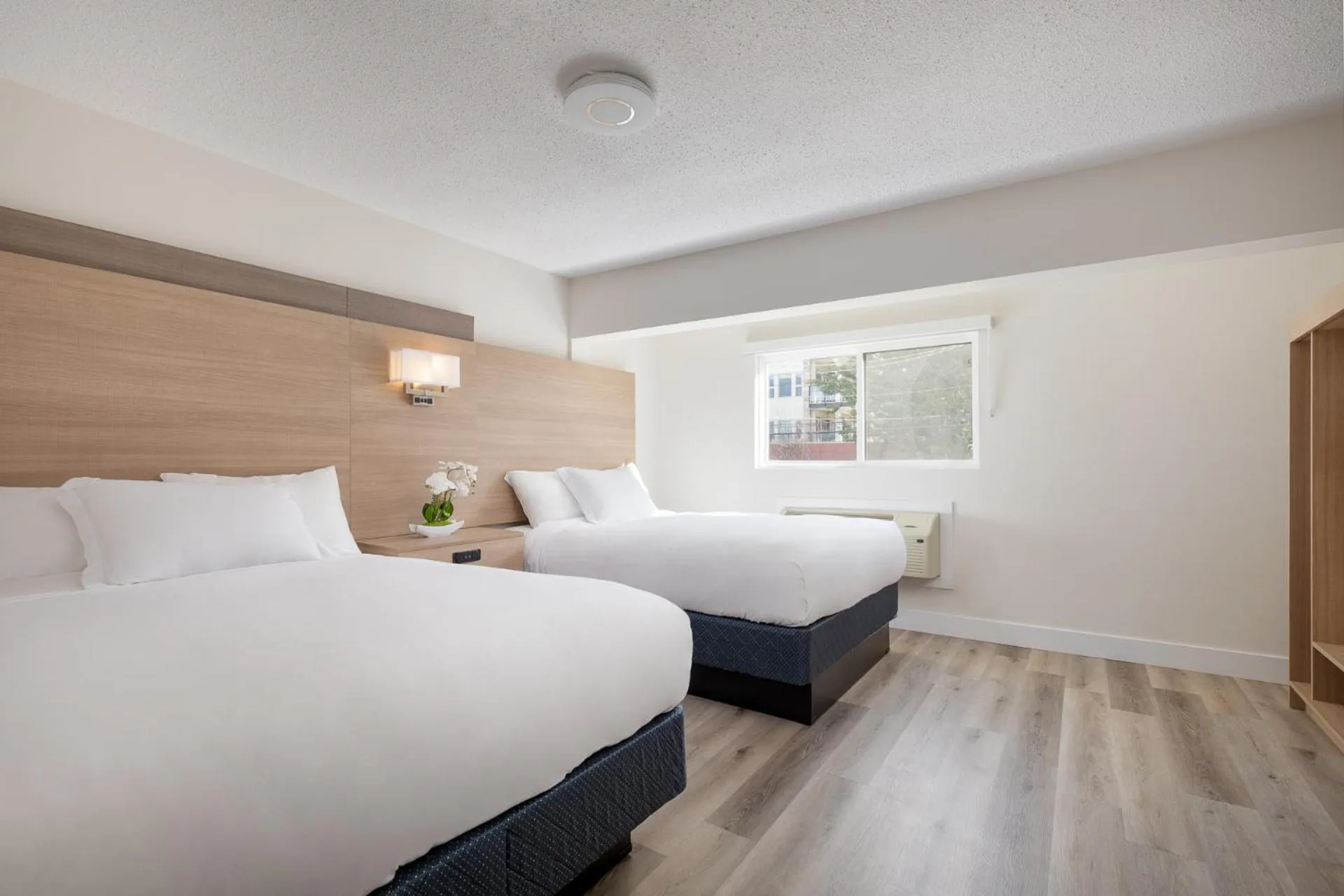 Bed in Harrison Grand Motel