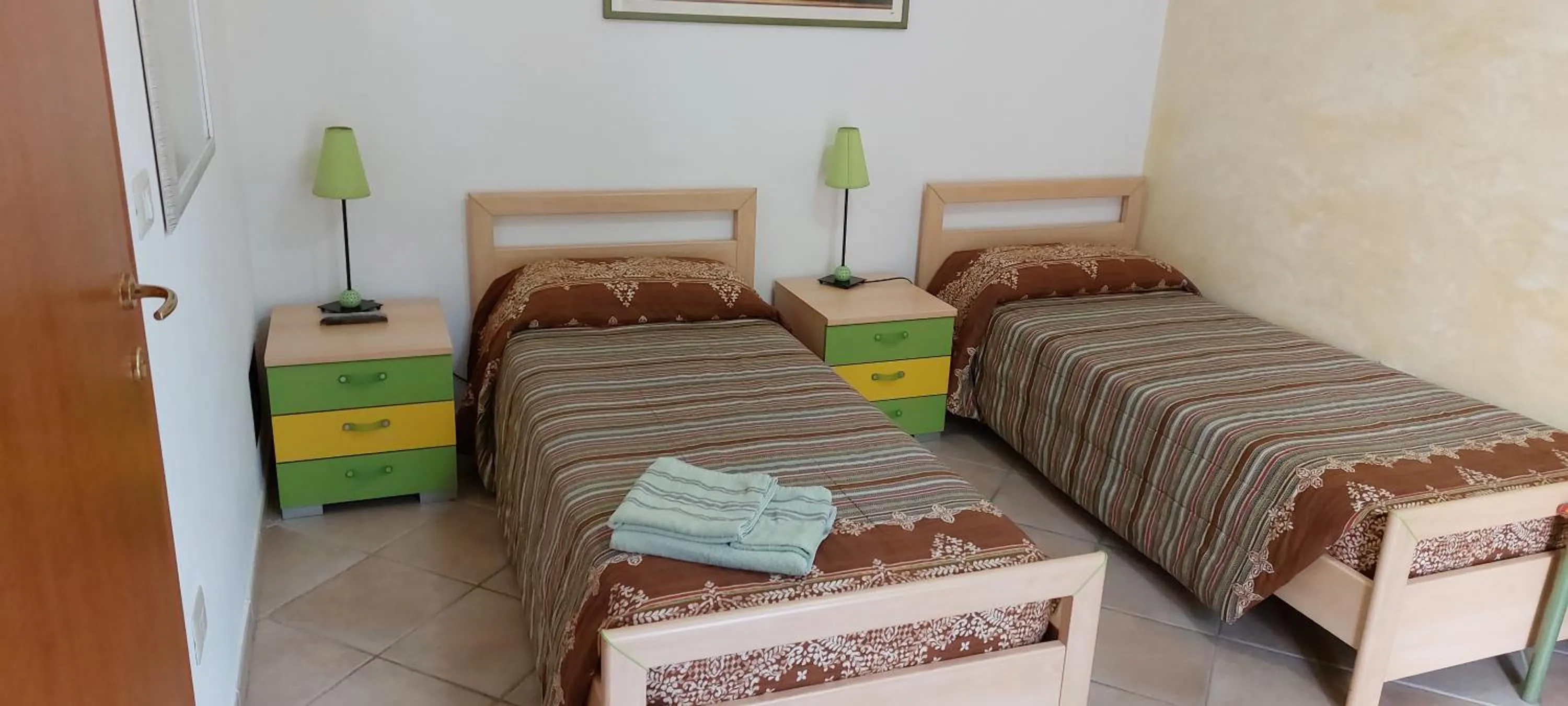 Bed in AFFITTACAMERE L'ARCOBALENO