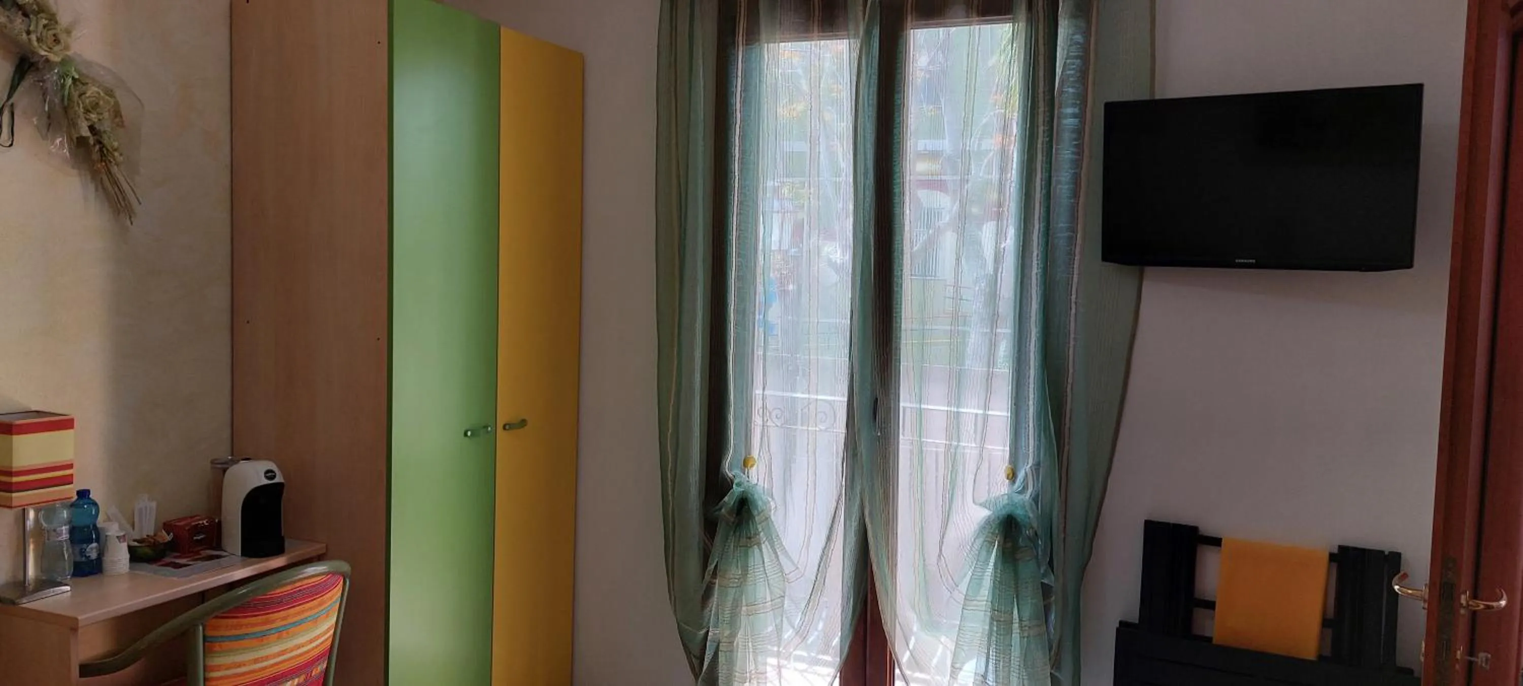 Bedroom in AFFITTACAMERE L'ARCOBALENO