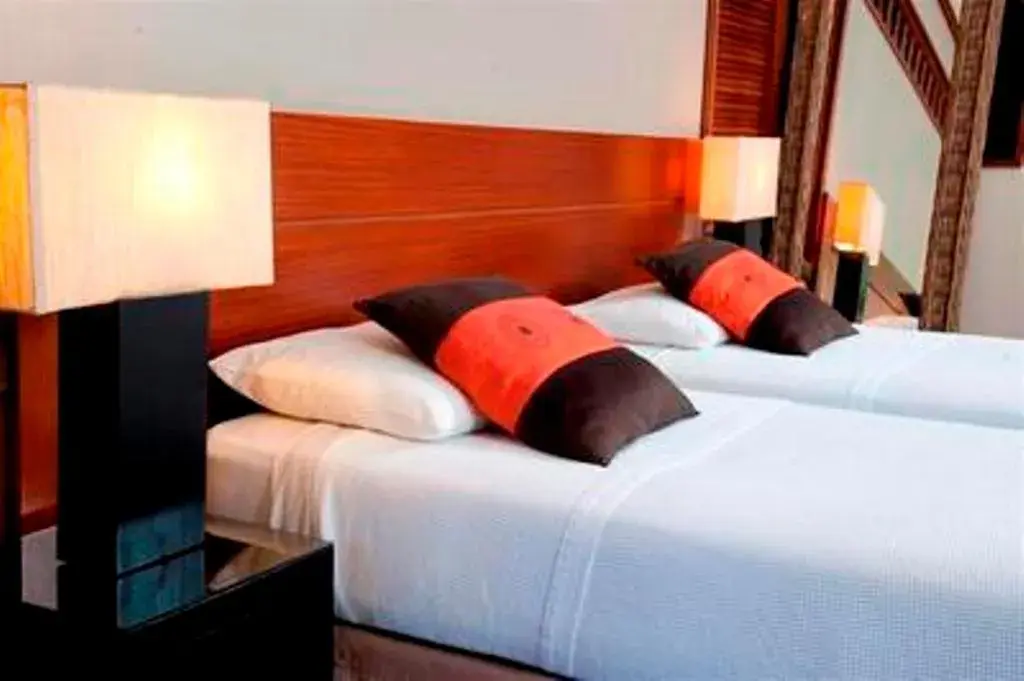 Bed in Oure Lodge Beach Resort Bed in Oure Lodge Beach Resort