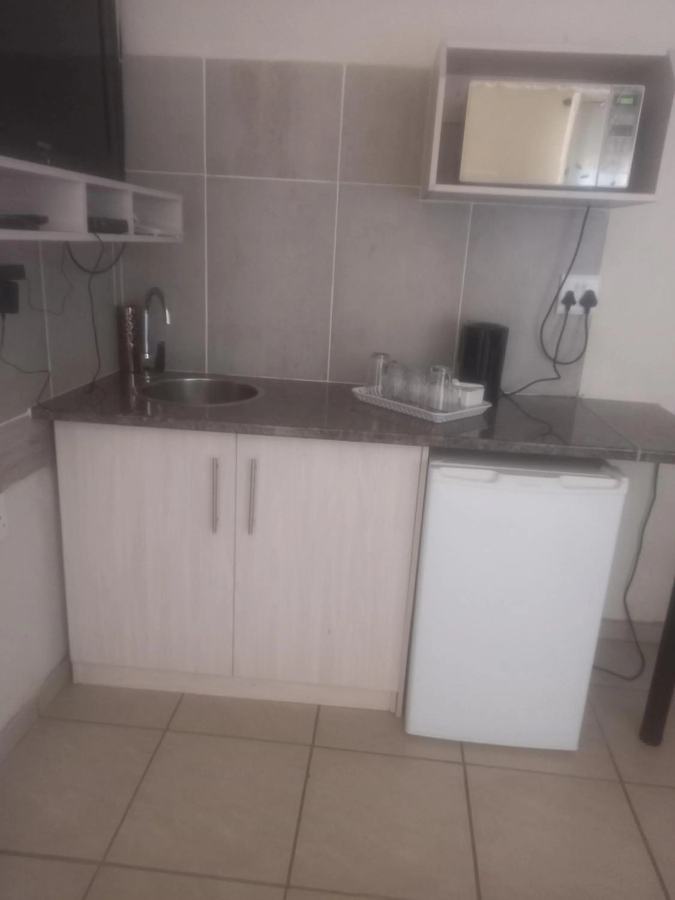 Kitchen or kitchenette in Kgatholoha Guest House