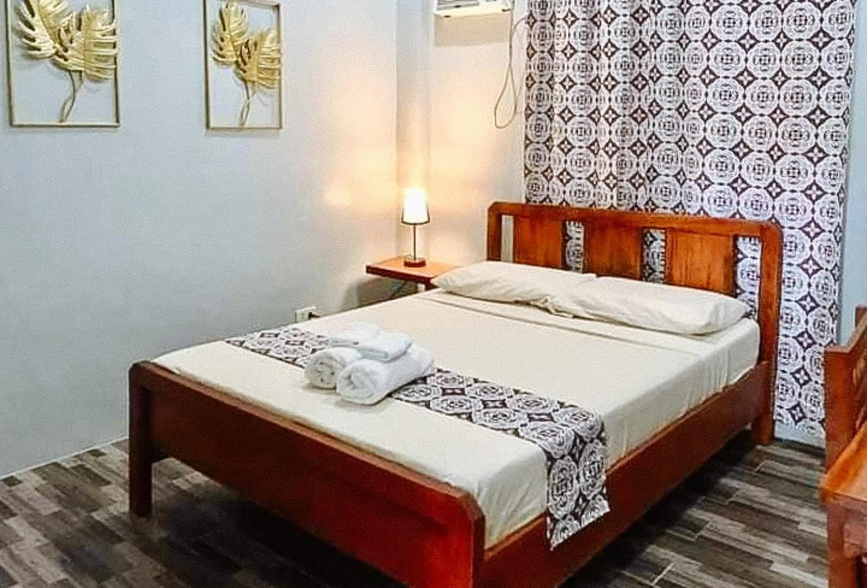 Bed in RedDoorz at Gracia's Calzada Inn Camiguin Bed in RedDoorz at Gracia's Calzada Inn Camiguin