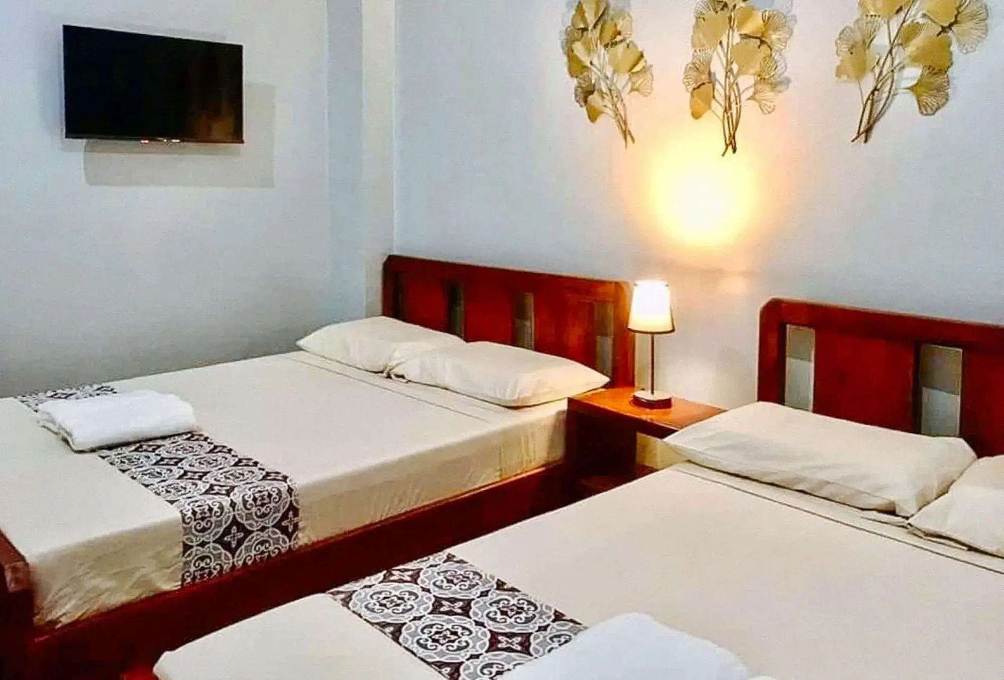 Bed in RedDoorz at Gracia's Calzada Inn Camiguin Bed in RedDoorz at Gracia's Calzada Inn Camiguin