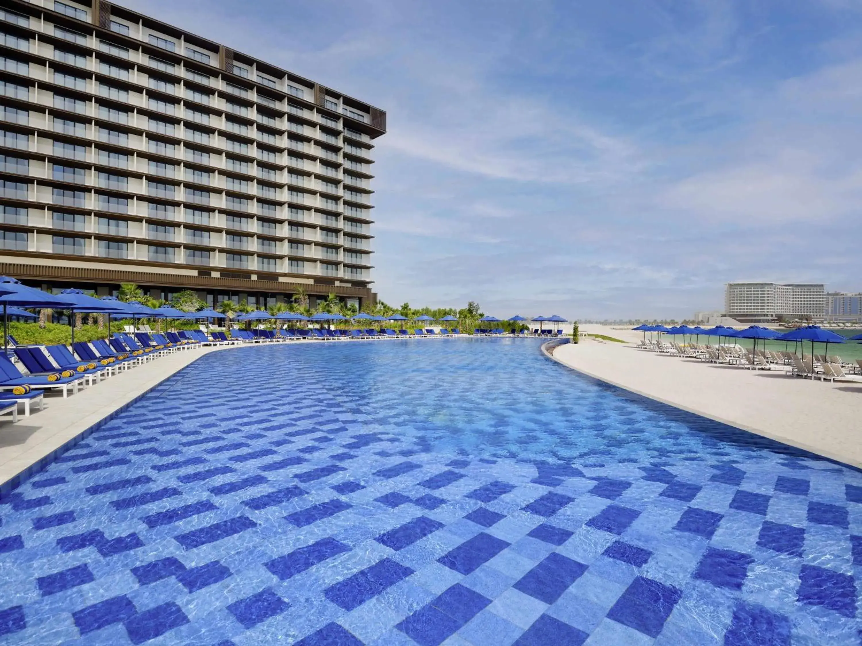 Pool view in Mövenpick Resort Al Marjan Island Pool view in Mövenpick Resort Al Marjan Island