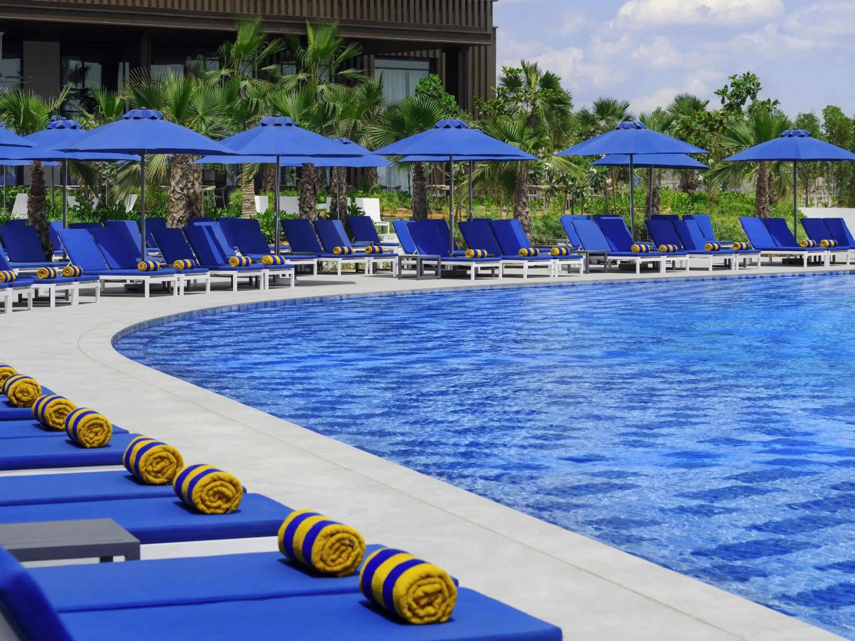 Pool view in Mövenpick Resort Al Marjan Island Pool view in Mövenpick Resort Al Marjan Island