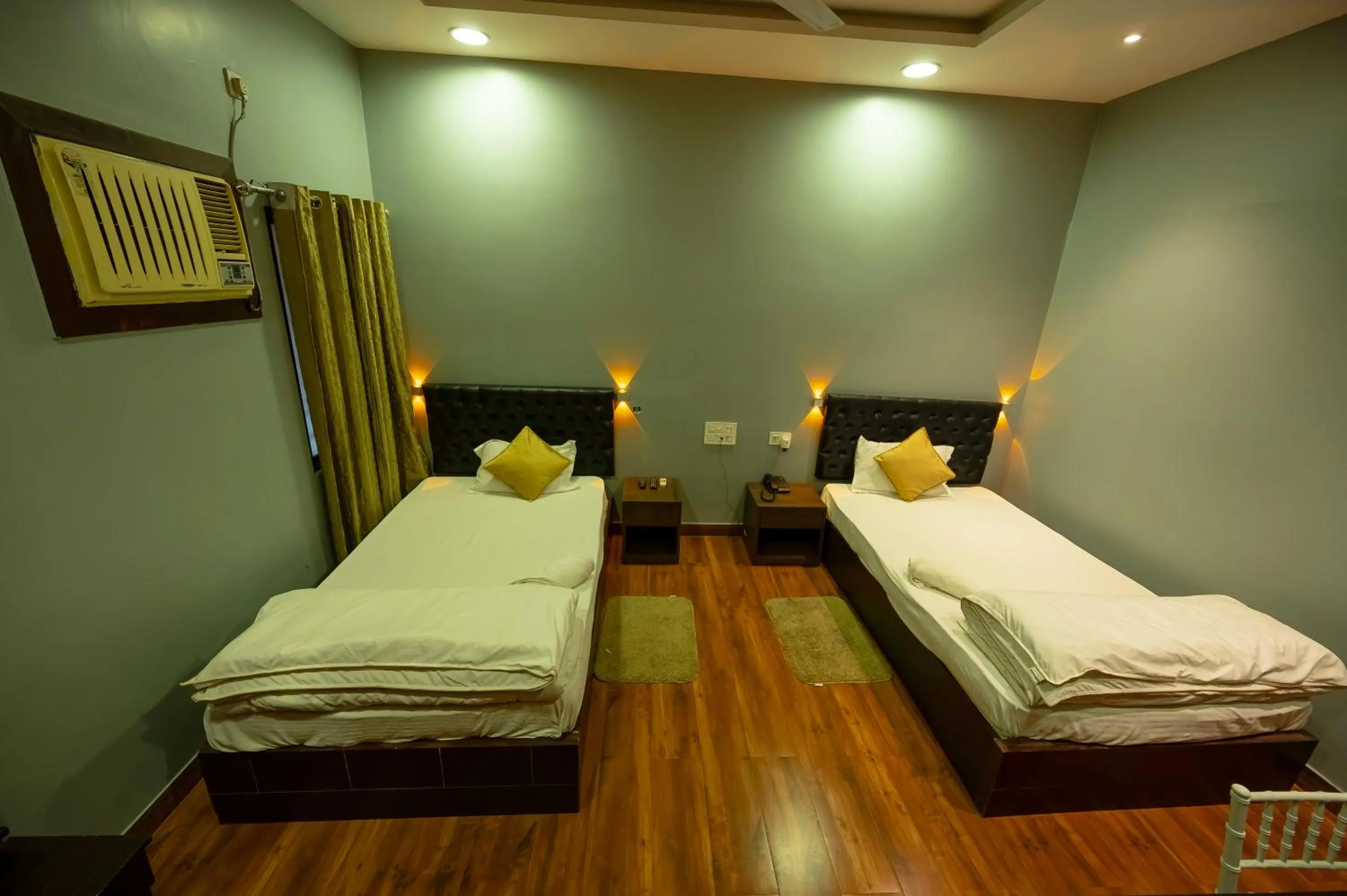 Bed in HOTEL MITTAL GARDEN