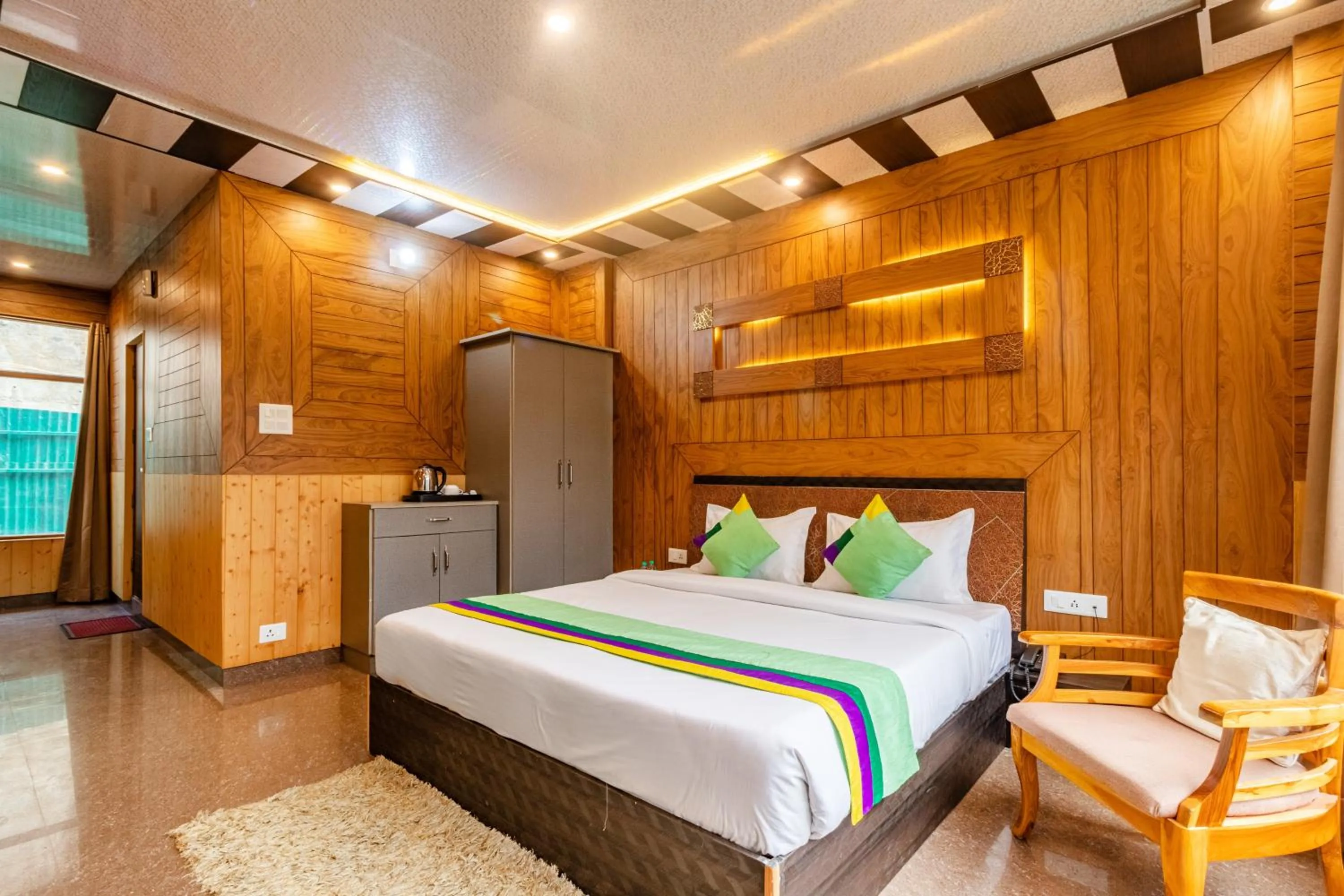 Bedroom in Treebo Srishti Vaikunth With Mountain View