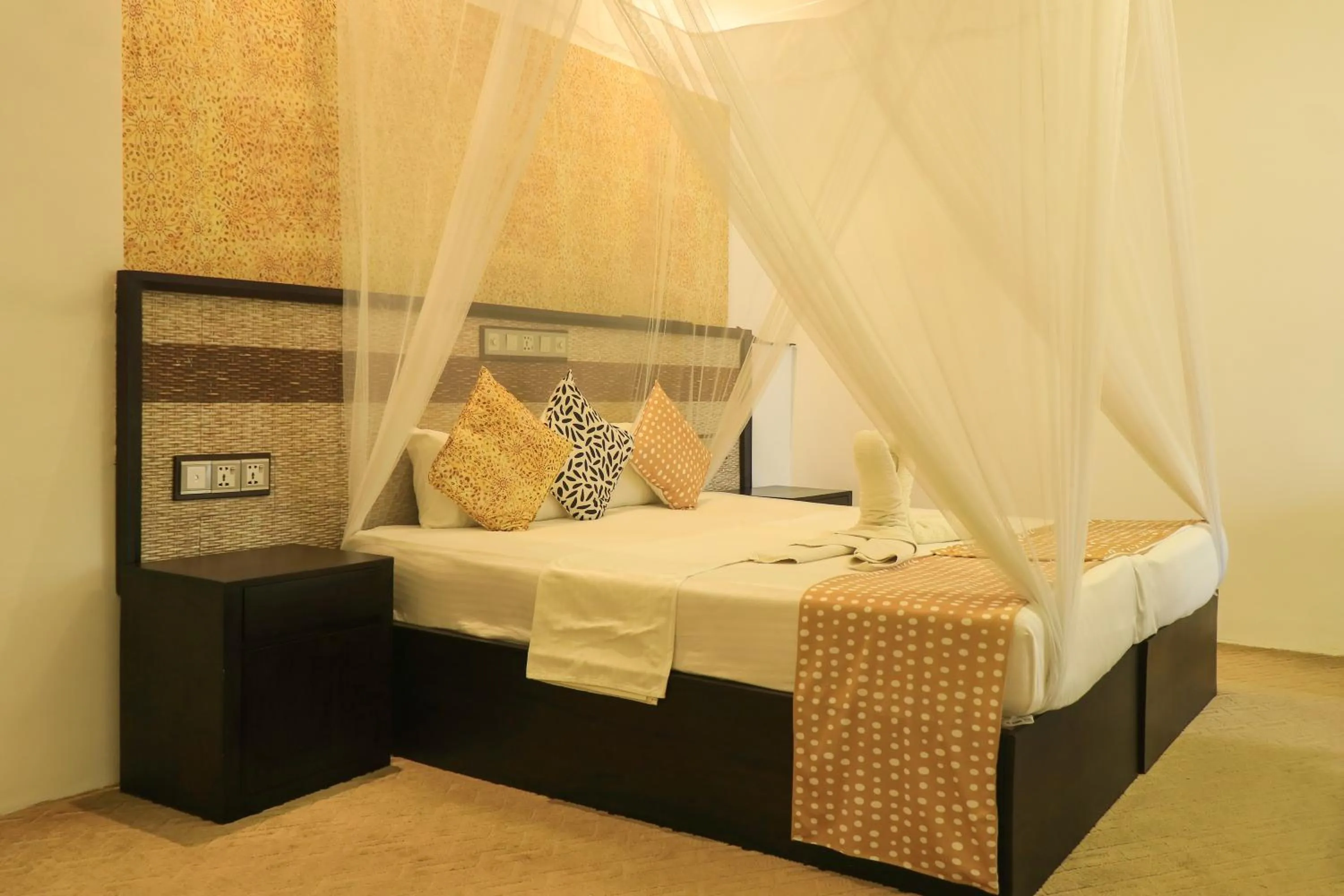 Bed in Thissa Inn Hotel