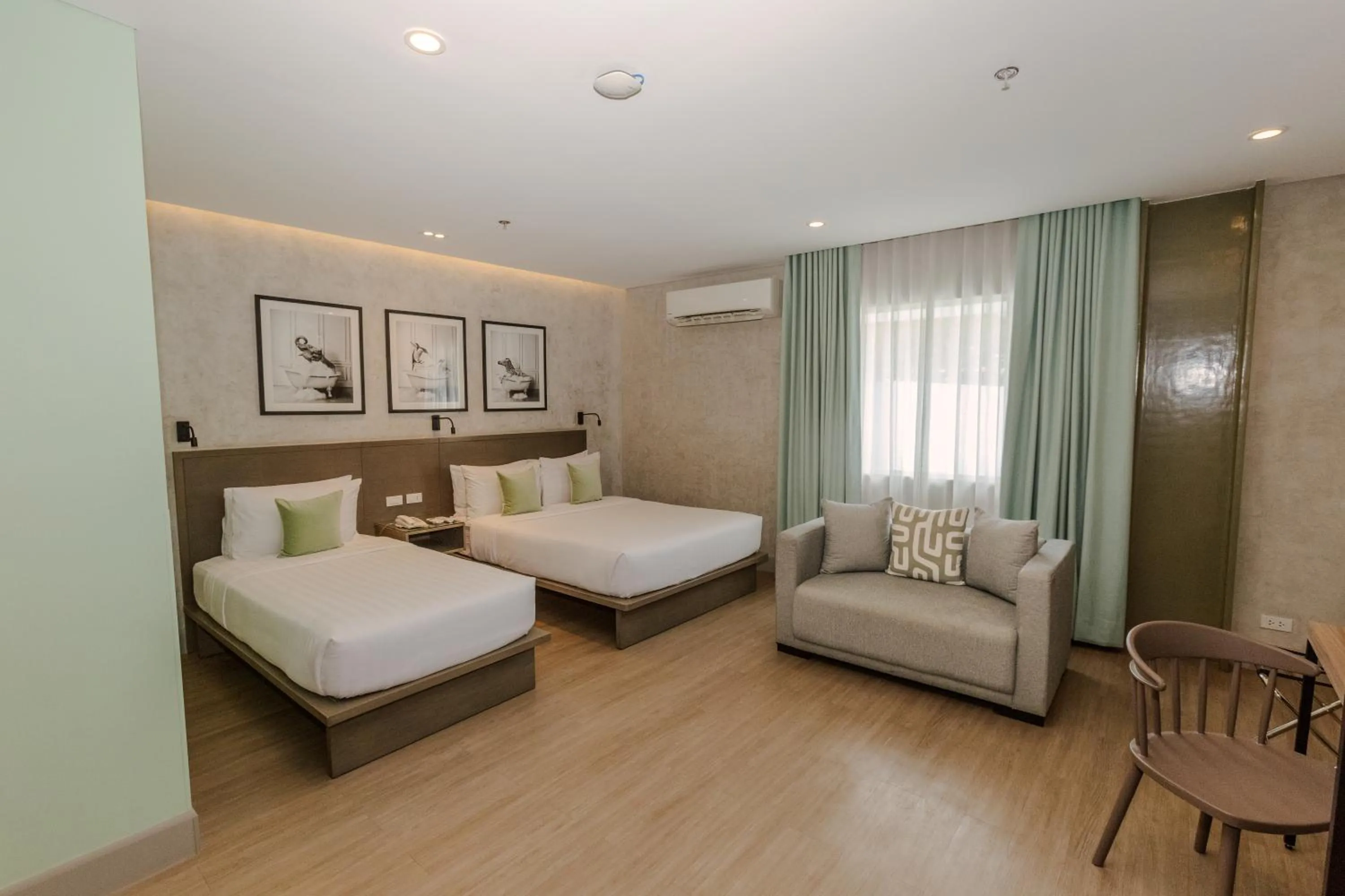 Living room, Bed in Primeway Suites Cebu