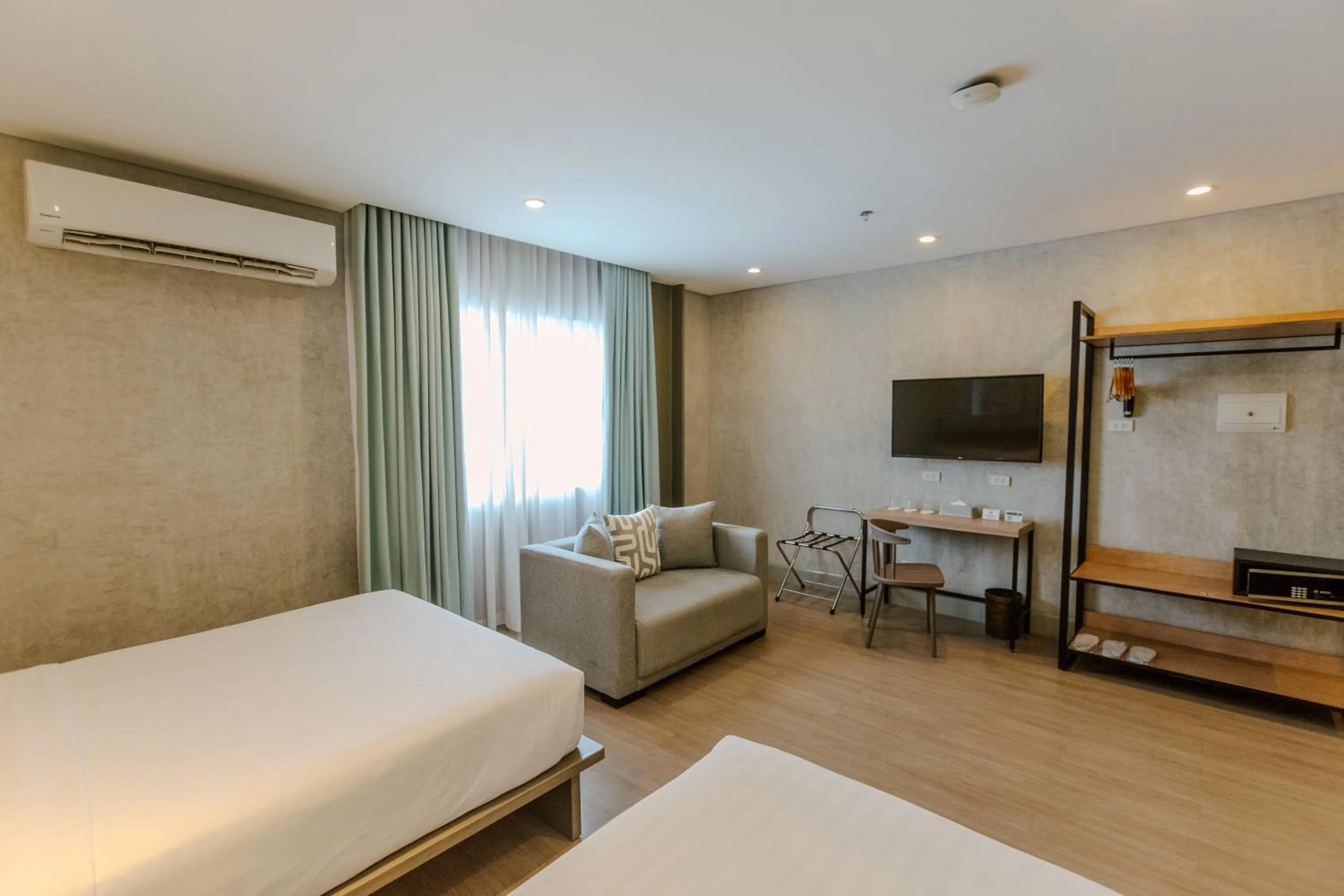 Seating area, Bed in Primeway Suites Cebu