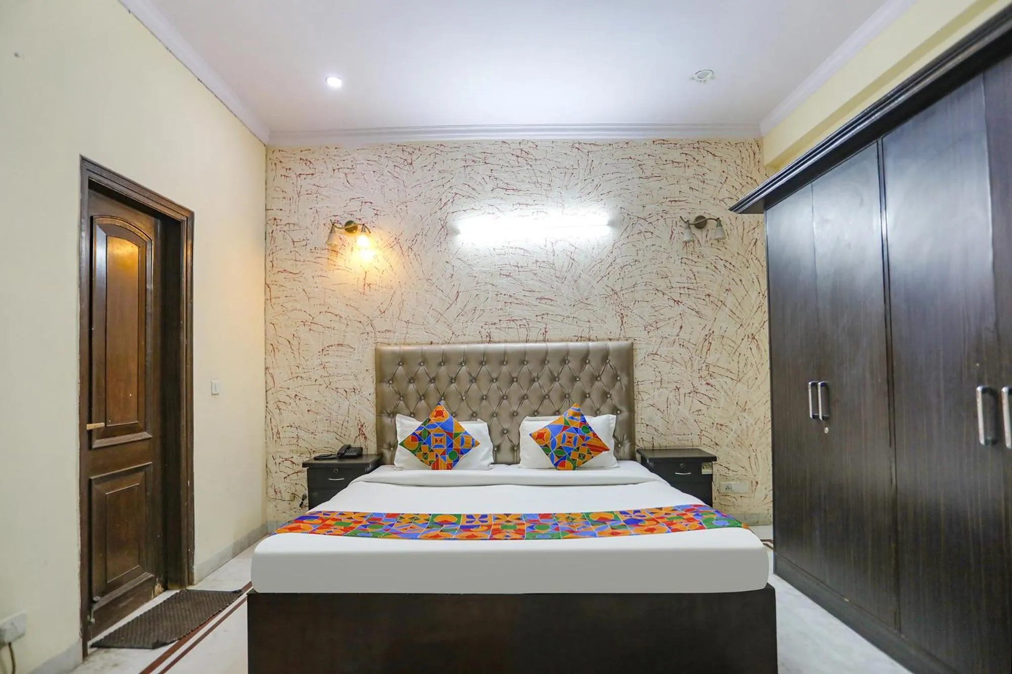 Bed in FabHotel HM Palace