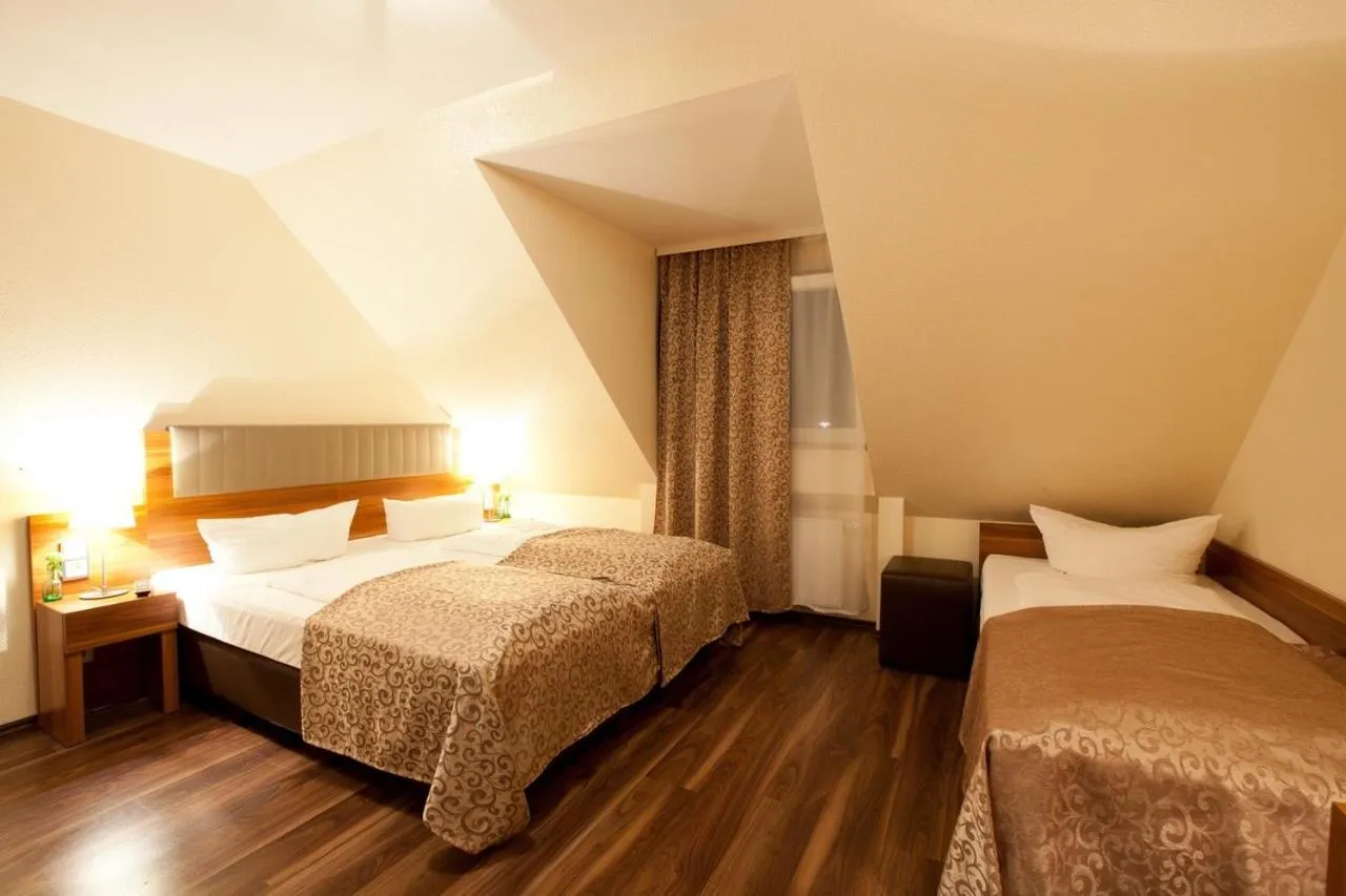 Photo of the whole room, Bed in Hotel Frankfurt Messe