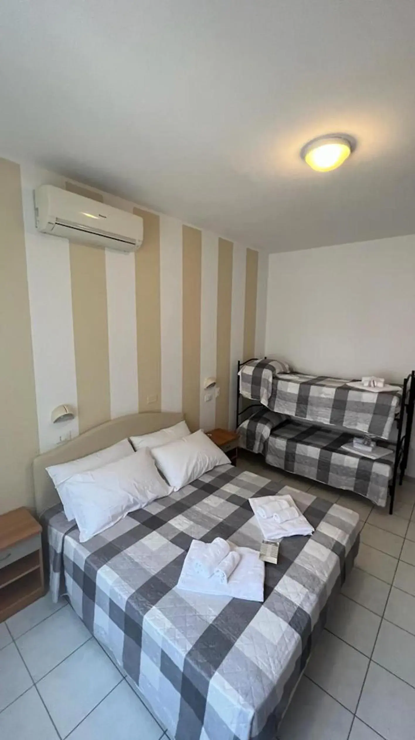 Standard Quadruple Room - single occupancy in chiAma Hotel Standard Quadruple Room - single occupancy in chiAma Hotel