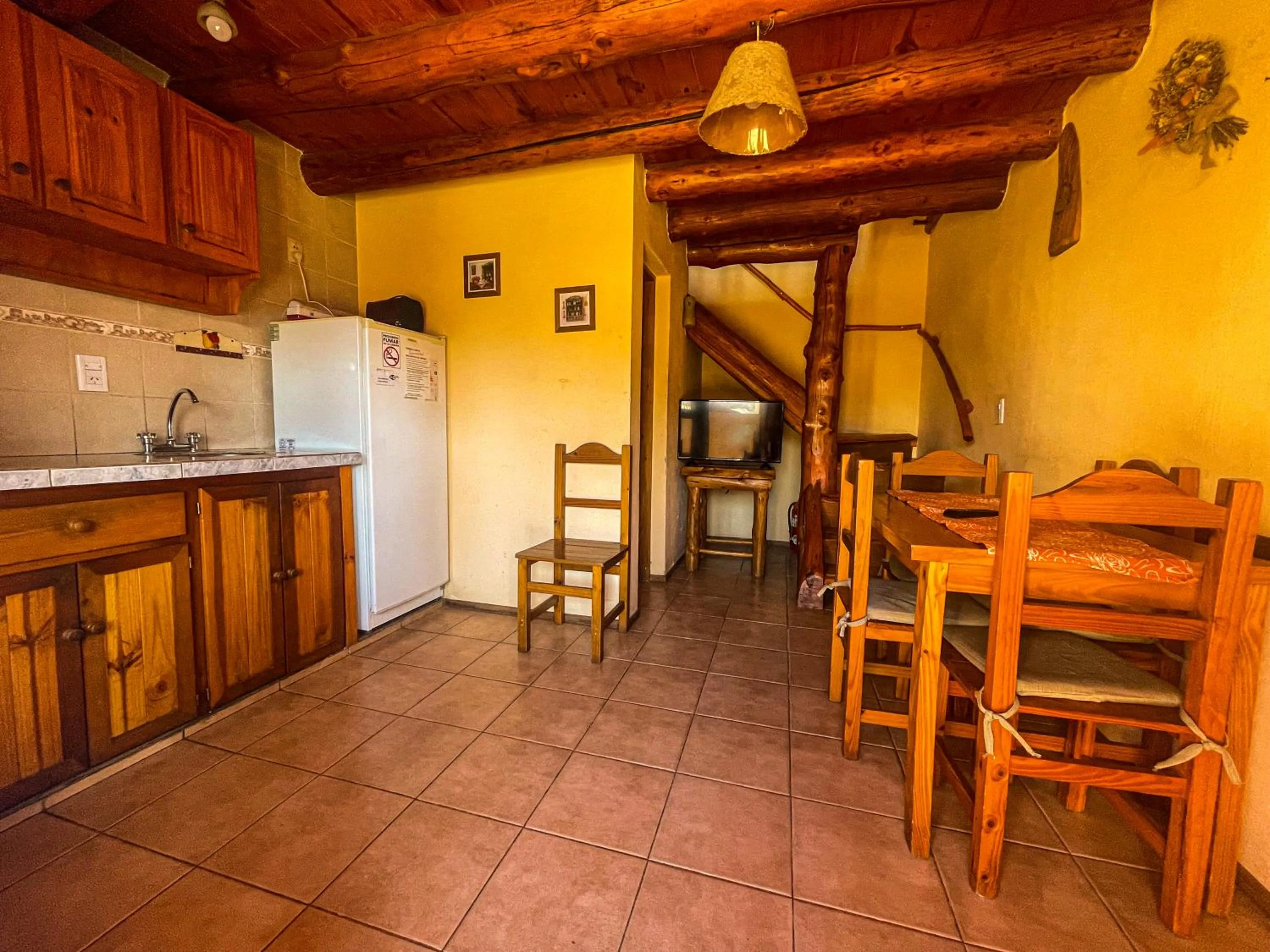 Kitchen or kitchenette in Cabañas Clarita