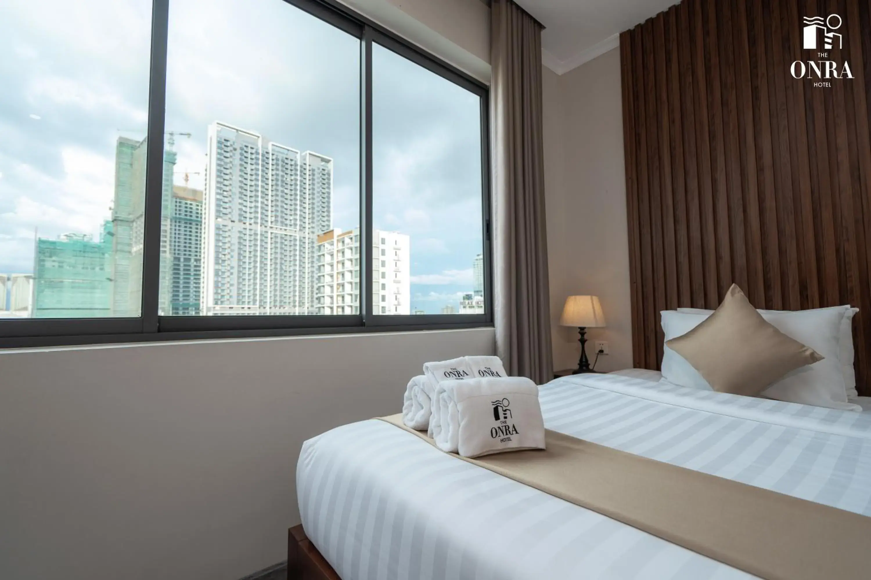 Bed in The ONRA Hotel Bed in The ONRA Hotel