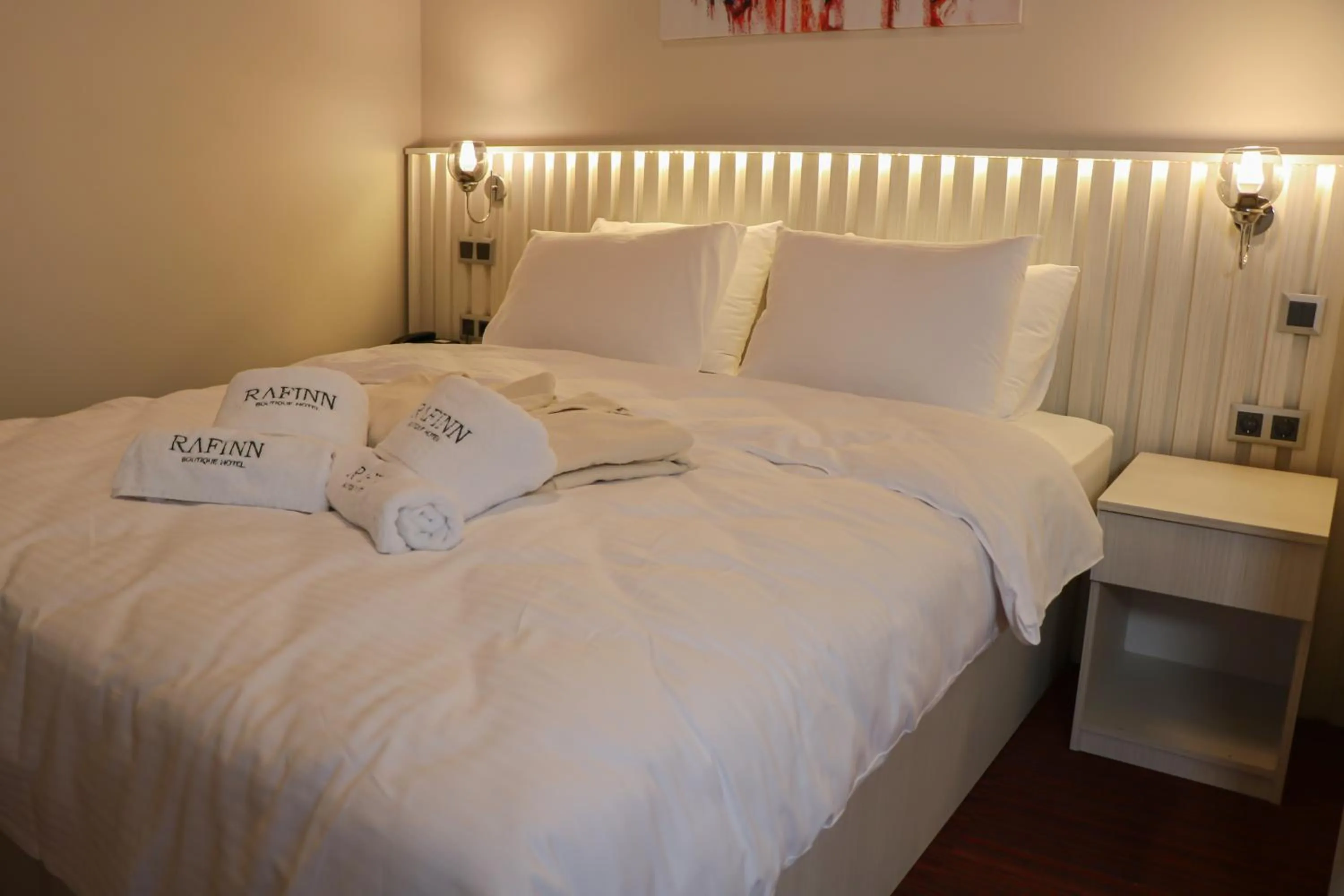 Bed in Rafinn Hotel