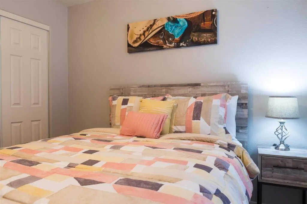 Bed in Cozy home with pool, fire table, BBQ, RV parking