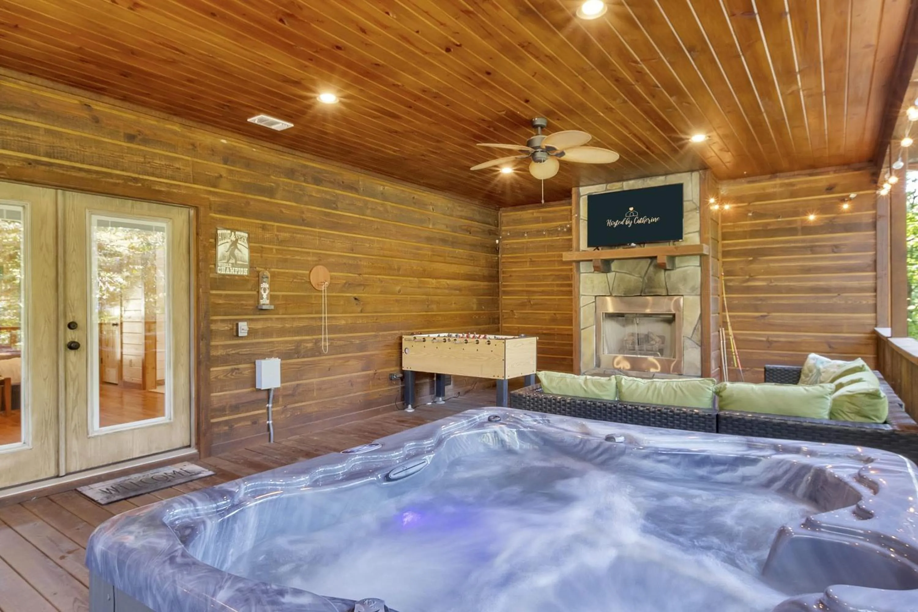 Bed in Gorgeous Idyllic Cabin w Hot Tub and Fire Pit Quittin Time is Secluded Romantic Oasis w Luxury Bathroom Double Shower and Bathtub Foosball Table