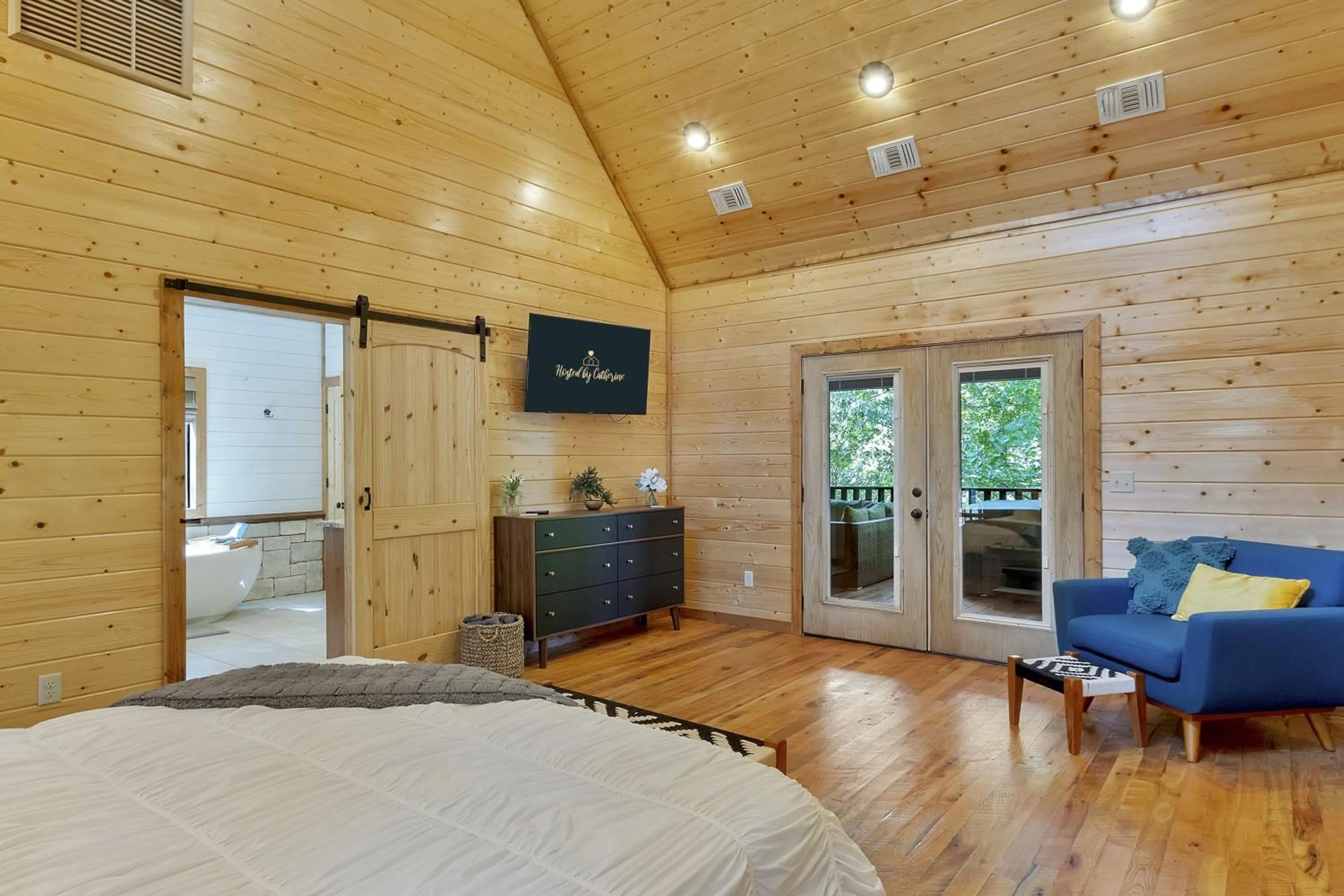 Bed in Gorgeous Idyllic Cabin w Hot Tub and Fire Pit Quittin Time is Secluded Romantic Oasis w Luxury Bathroom Double Shower and Bathtub Foosball Table