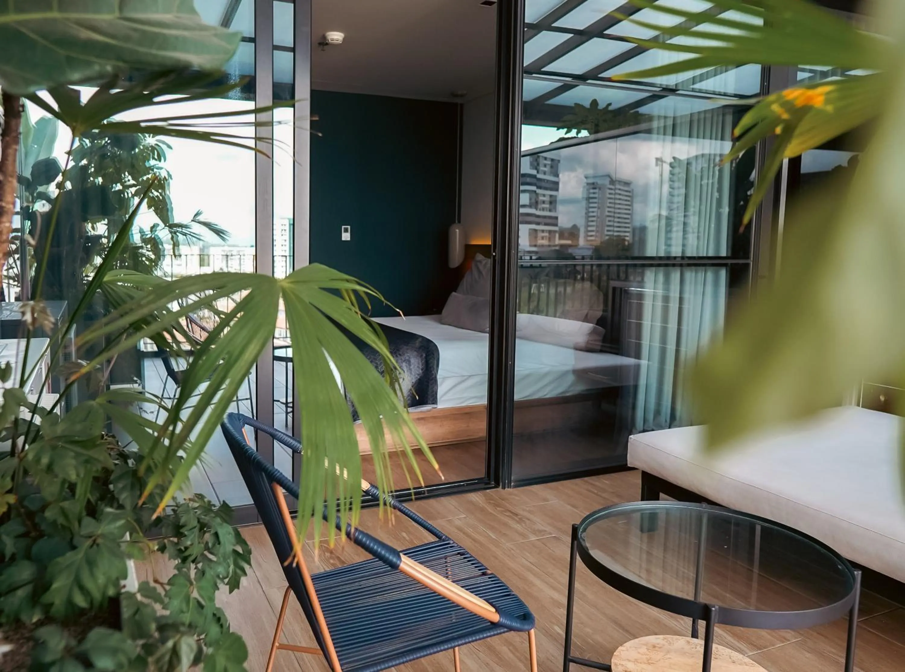 Living room, Bed in Hotel Sexto by Icono