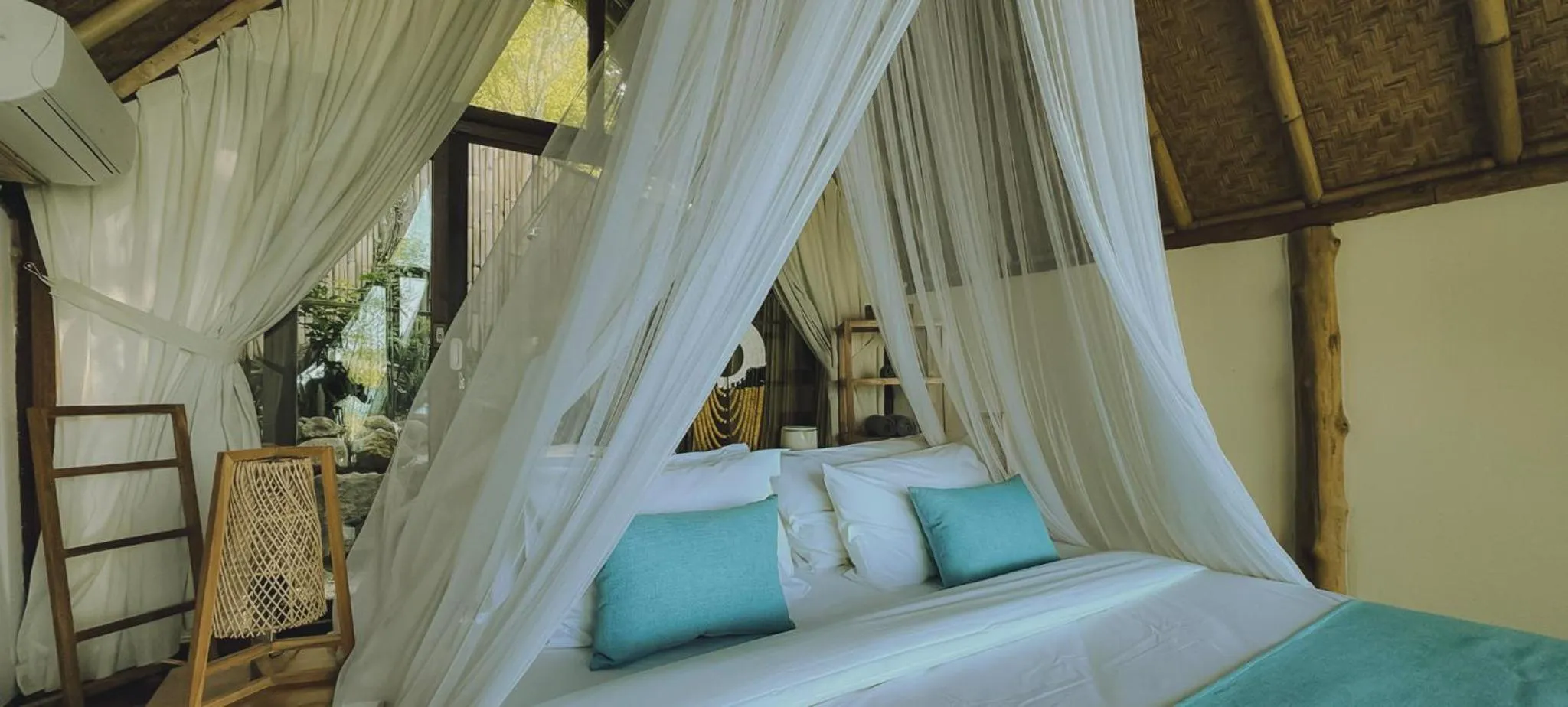 Bed in Kirana Retreat - Beach Front Resort