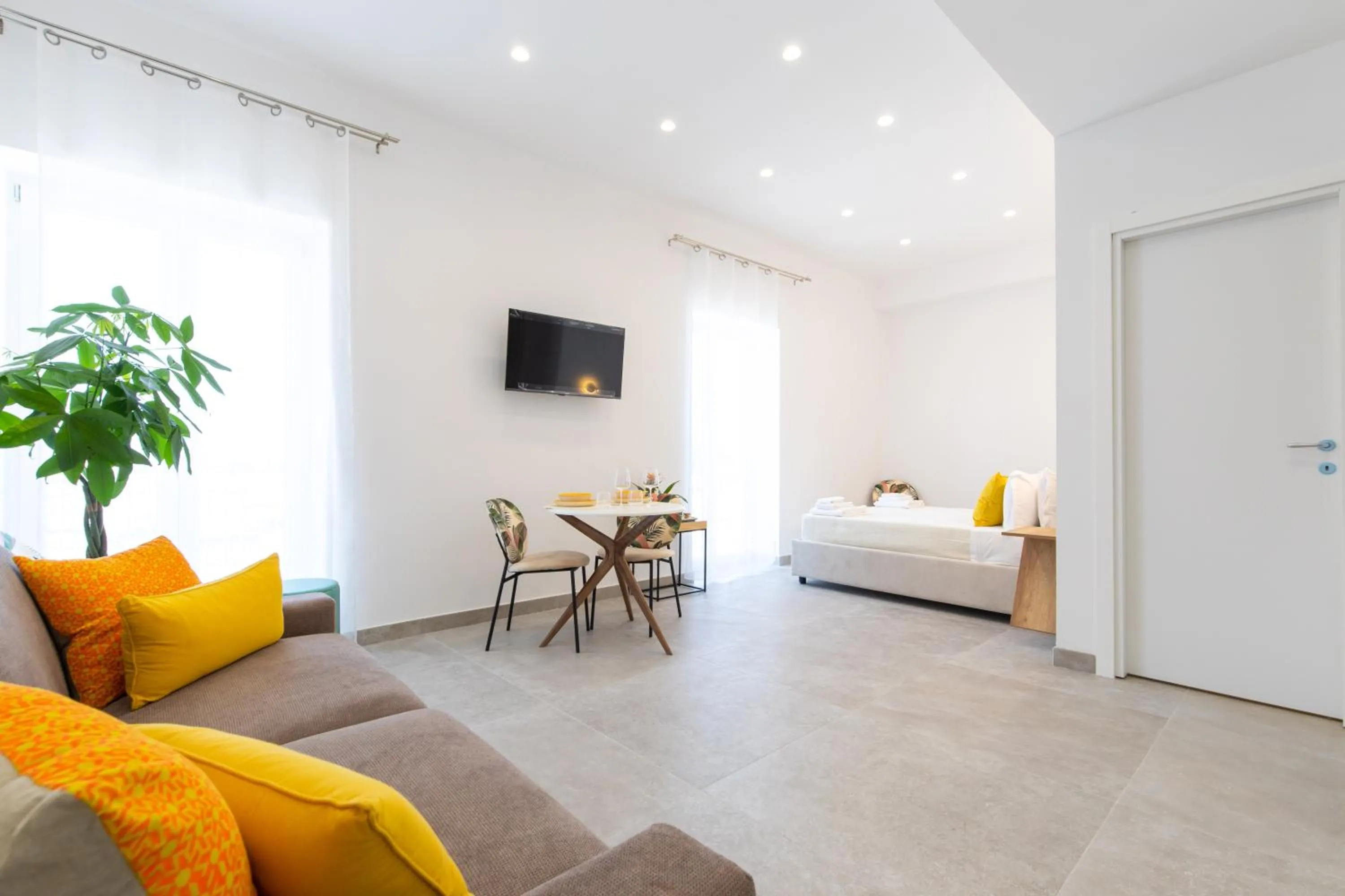 Living room, Bed in Baia Flegrea Meublè