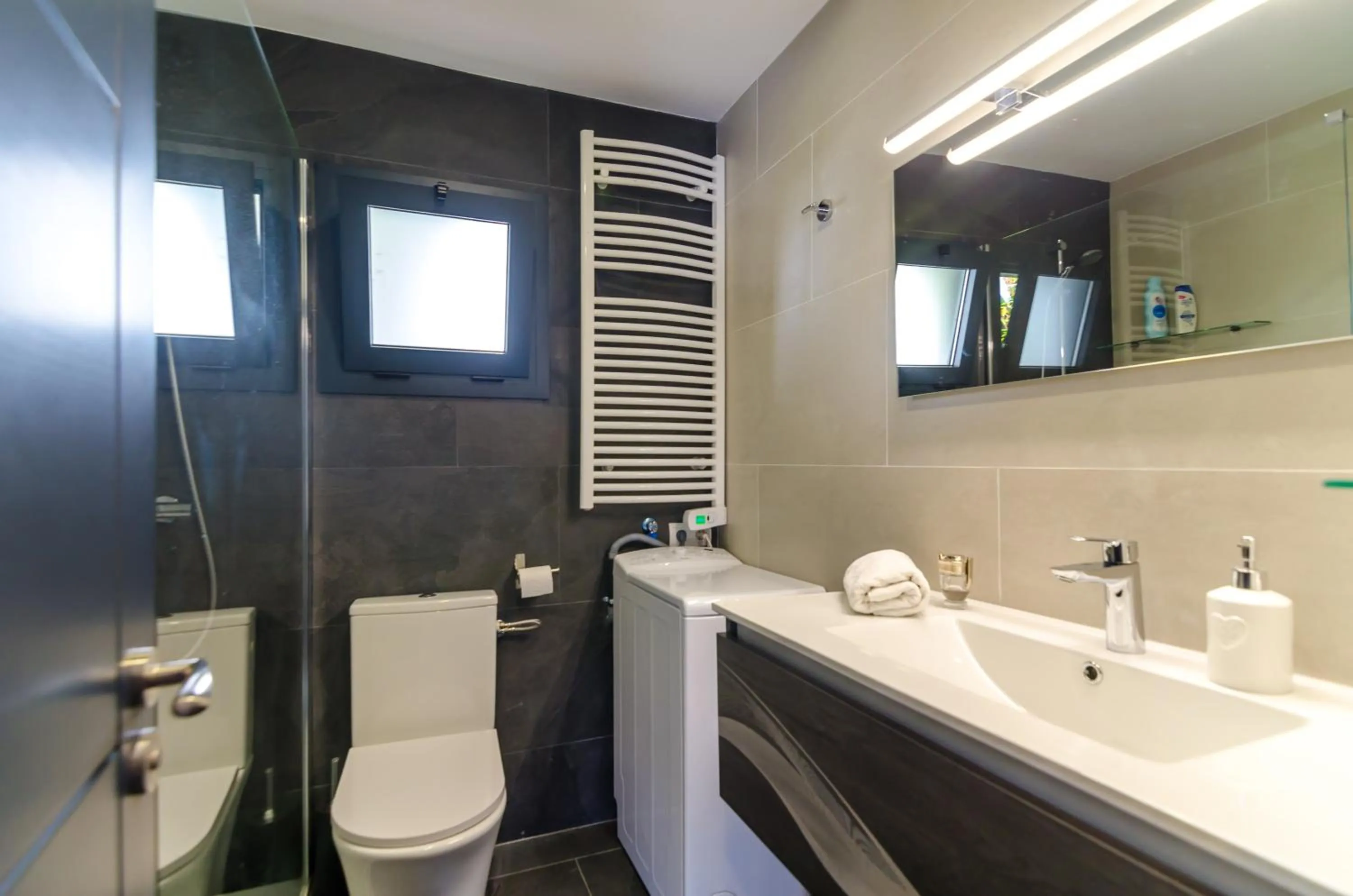 Bathroom in Seaside villa in Lloret de Mar with garden and pool view