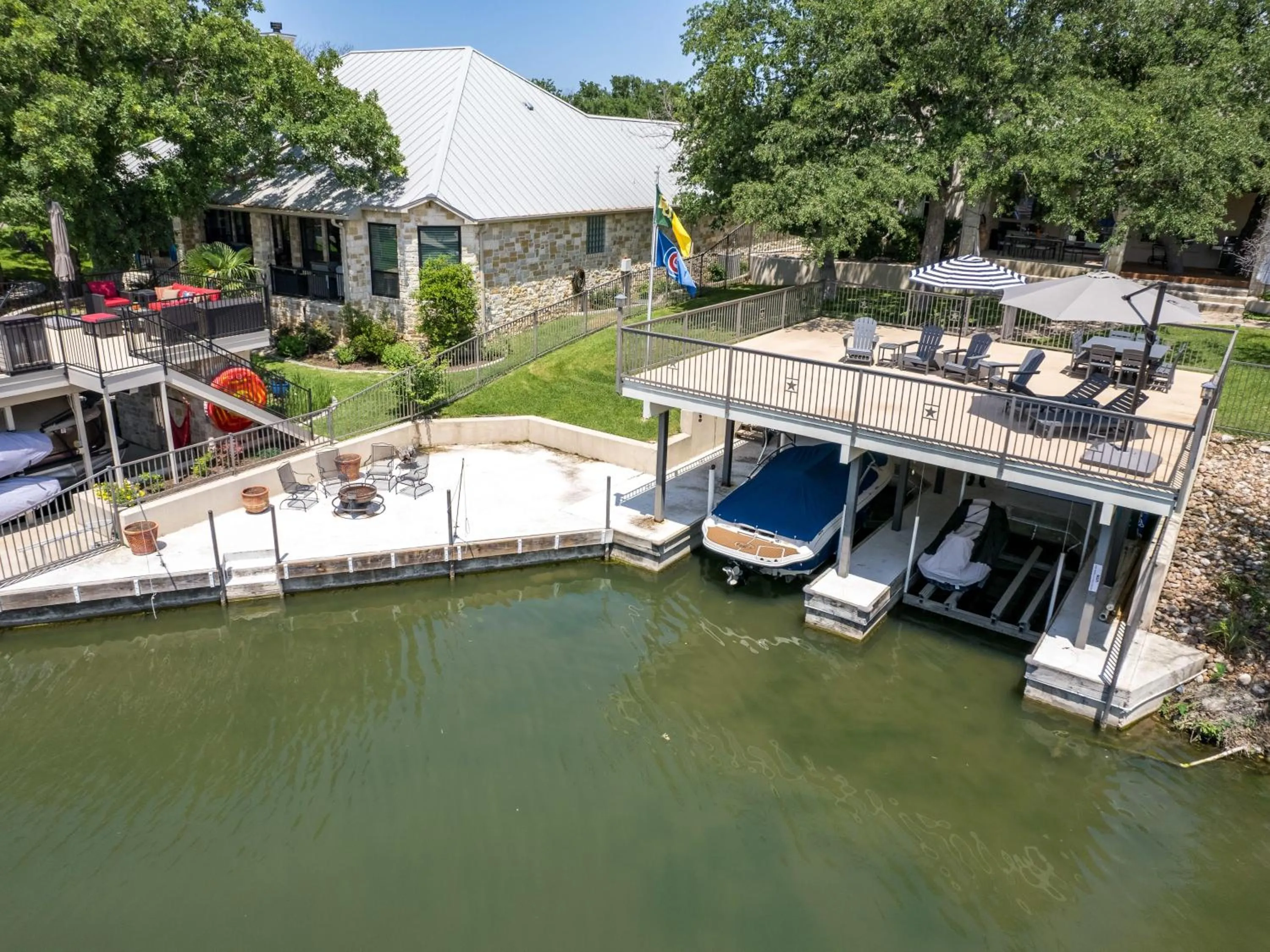 Waterfront Home with Boat Slip, Spacious Outdoor Patio and a Fenced Yard
