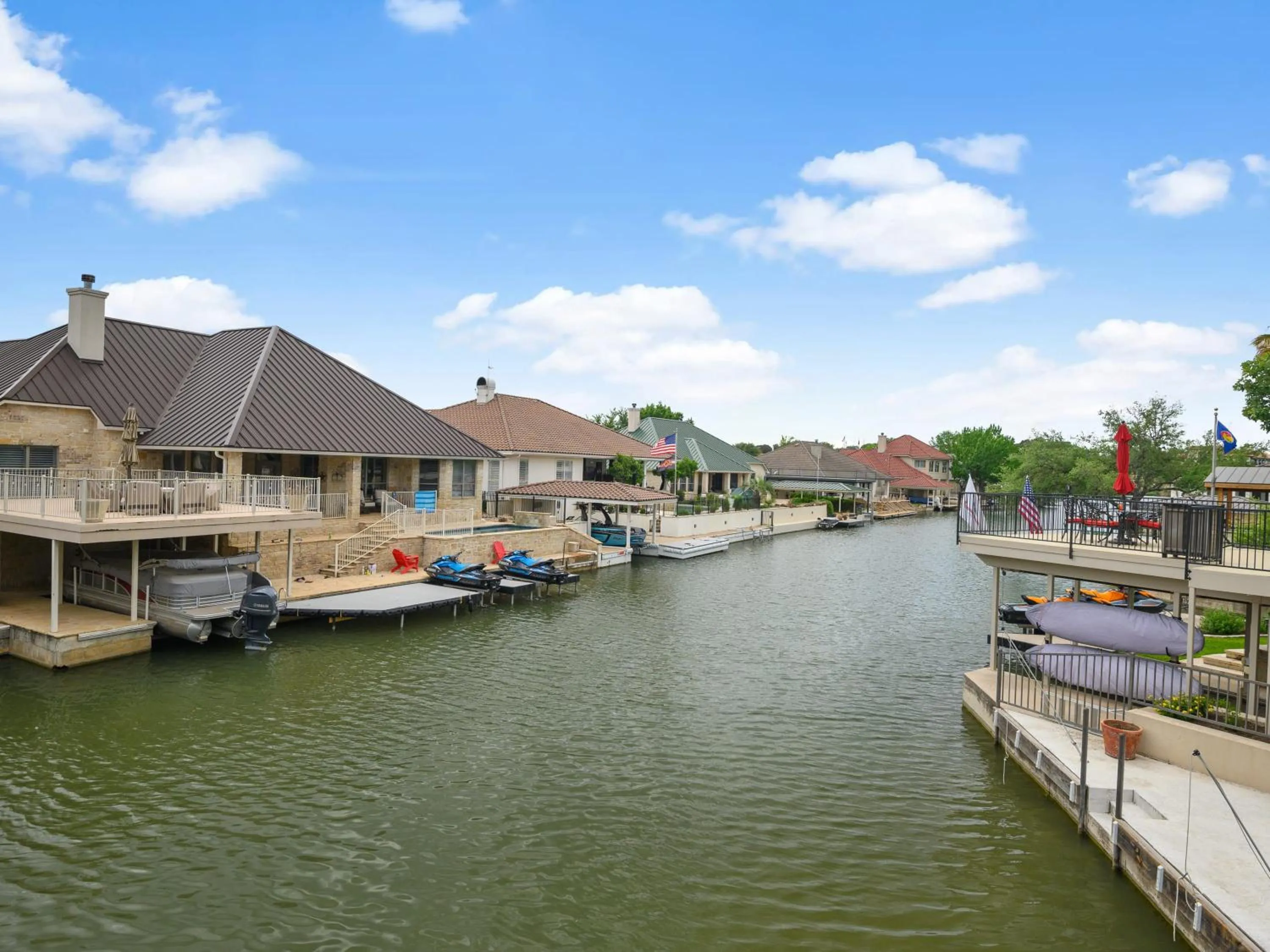 Waterfront Home with Boat Slip, Spacious Outdoor Patio and a Fenced Yard