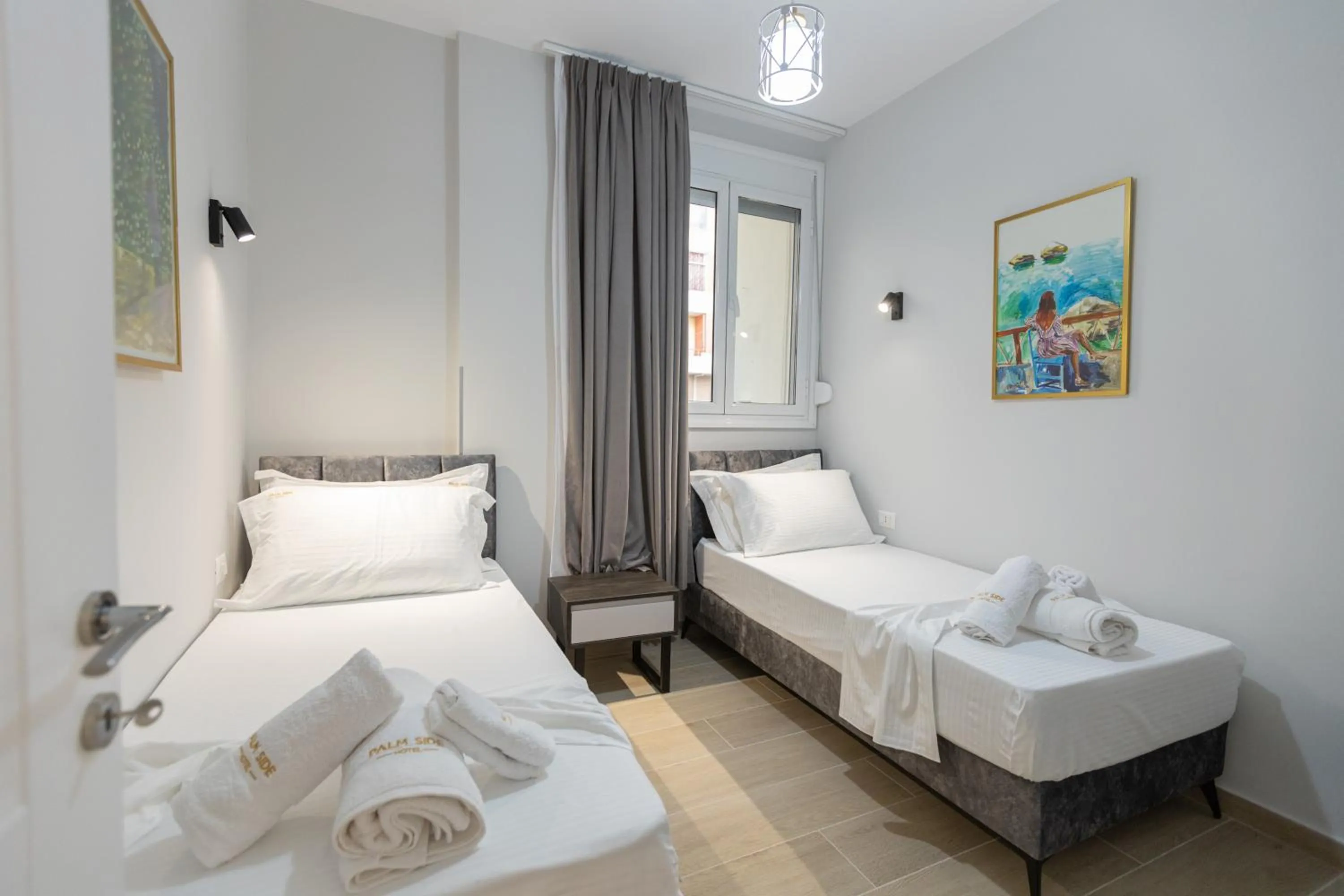 Bed in Palm Side Hotel