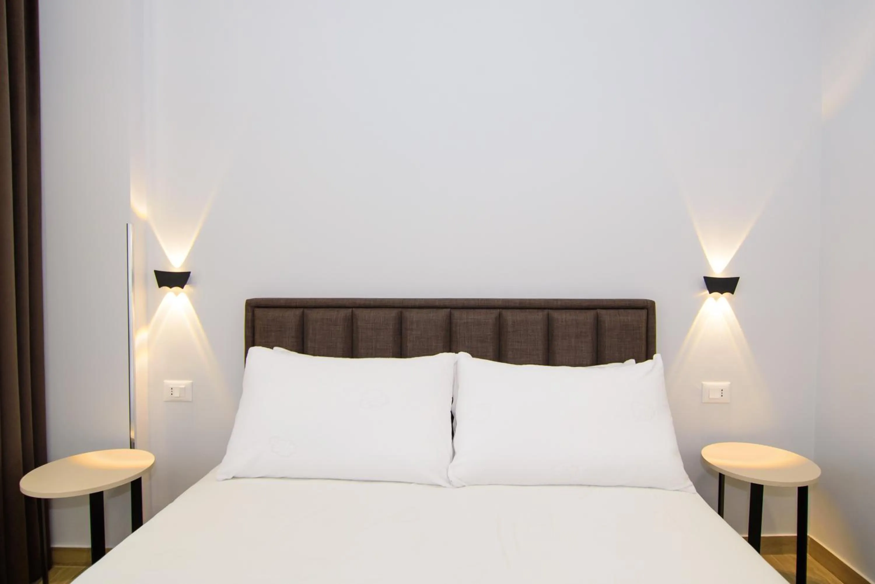 Bed in Palm Side Hotel