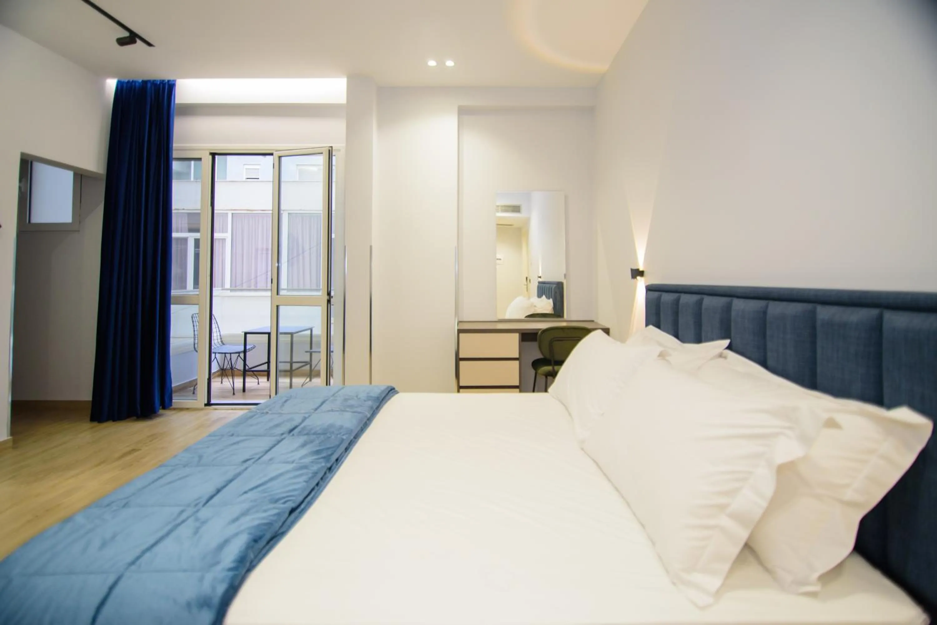 Bed in Palm Side Hotel