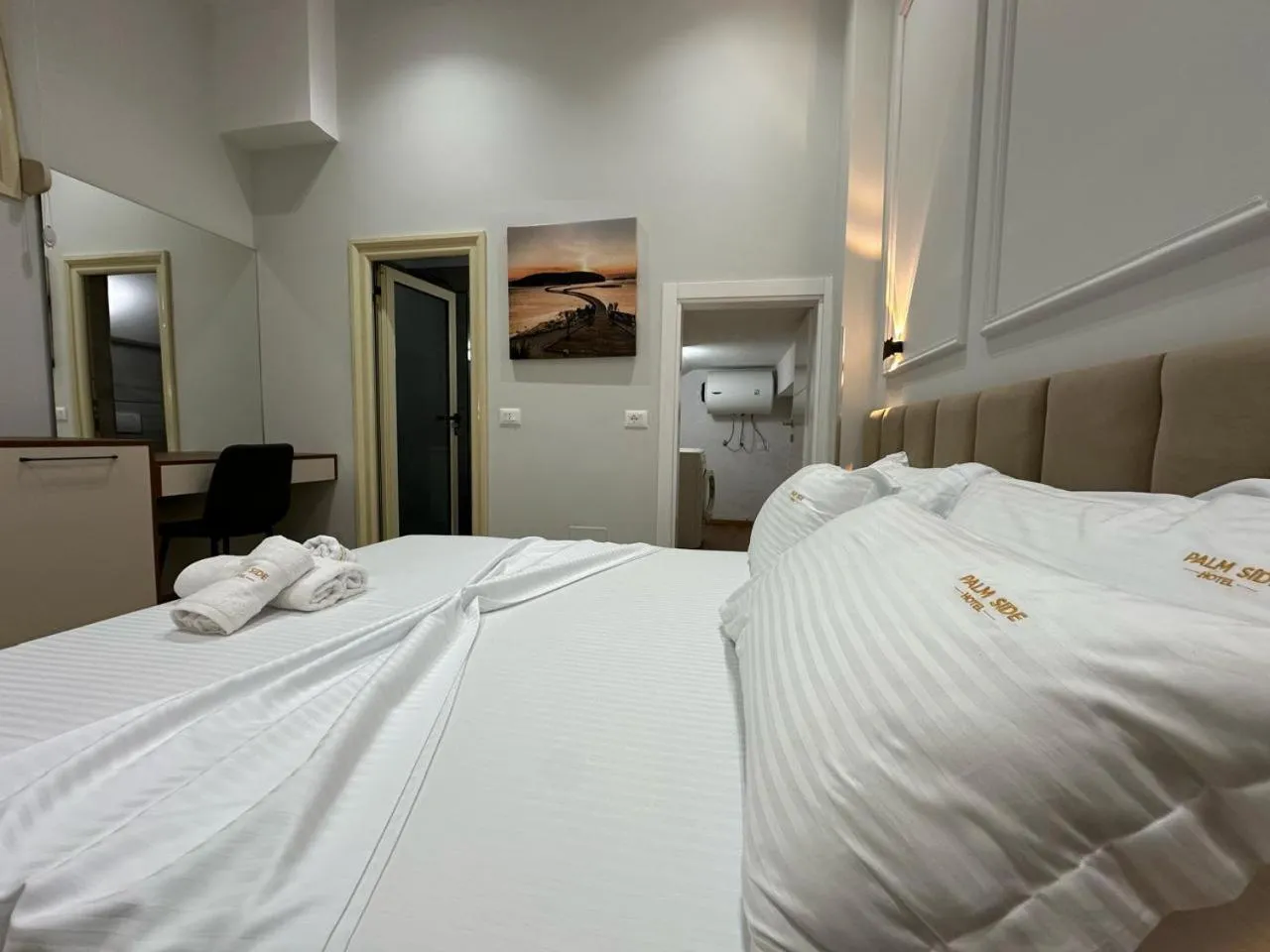 Bed in Palm Side Hotel