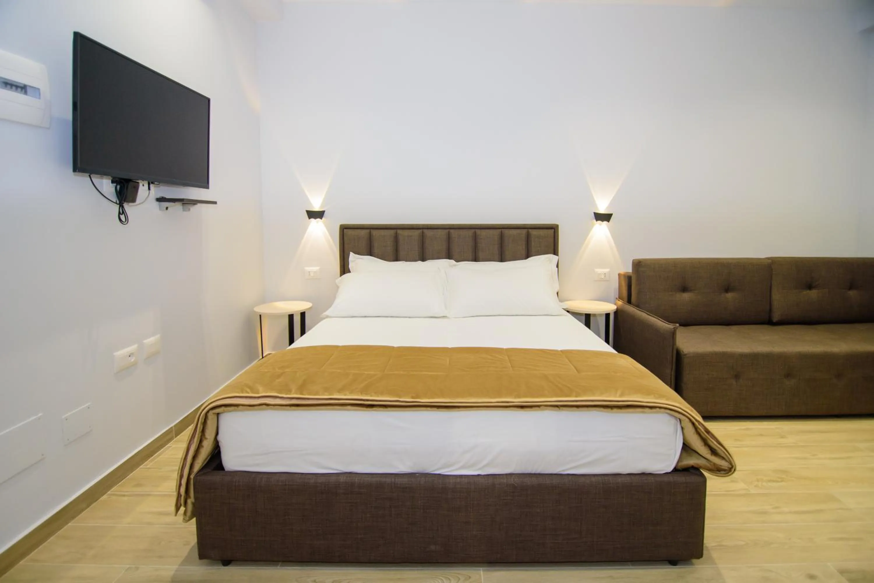 Bed in Palm Side Hotel