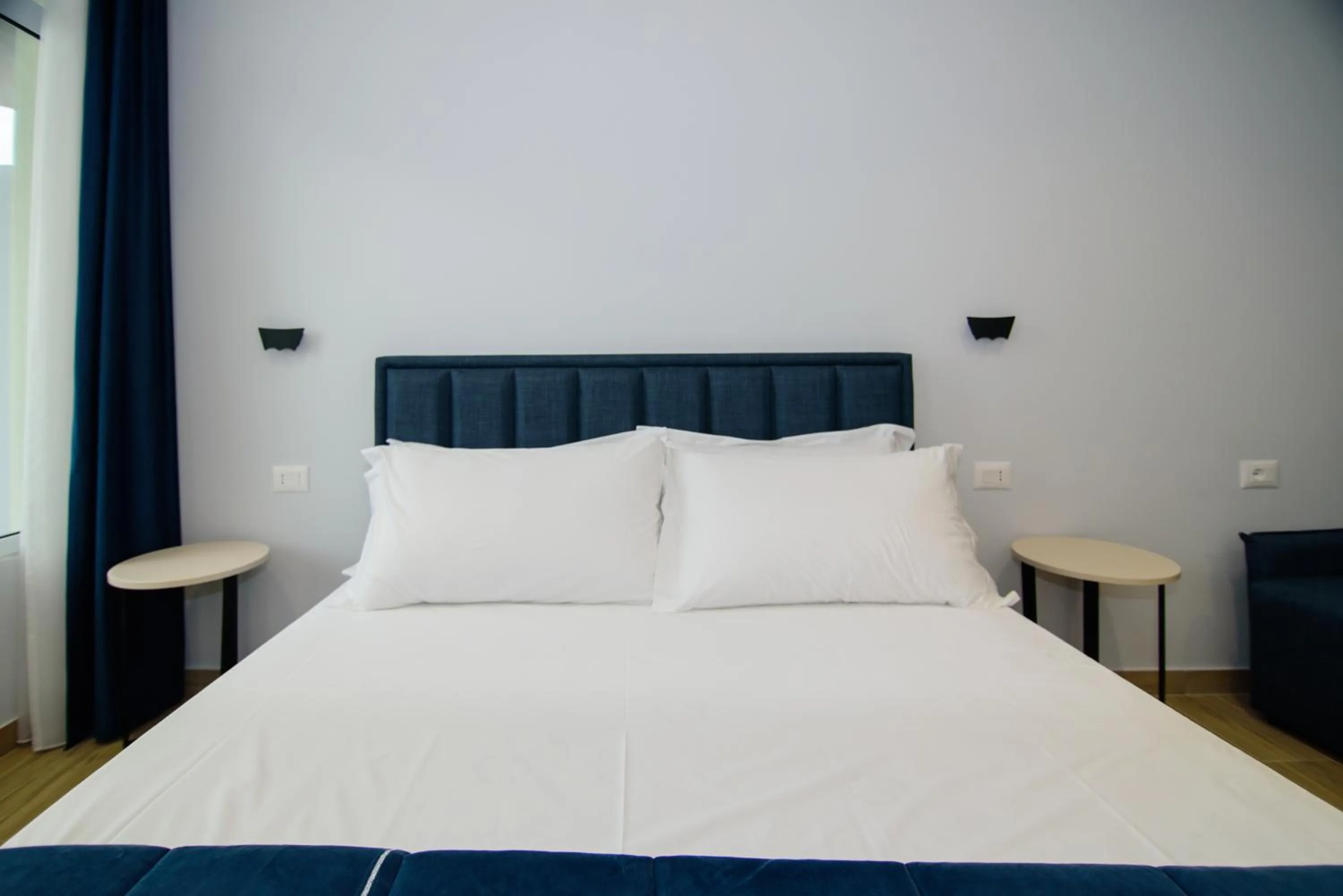 Bed in Palm Side Hotel