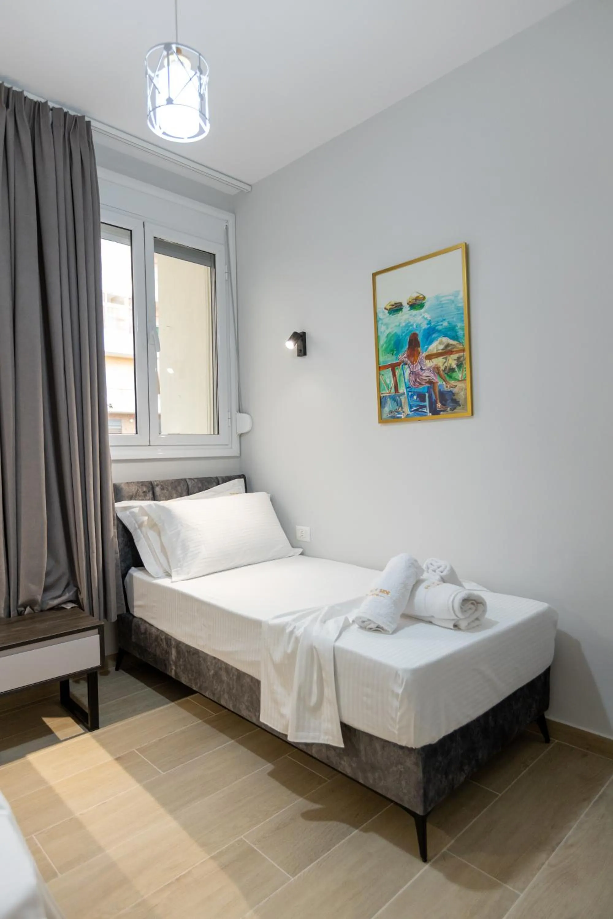 Bed in Palm Side Hotel