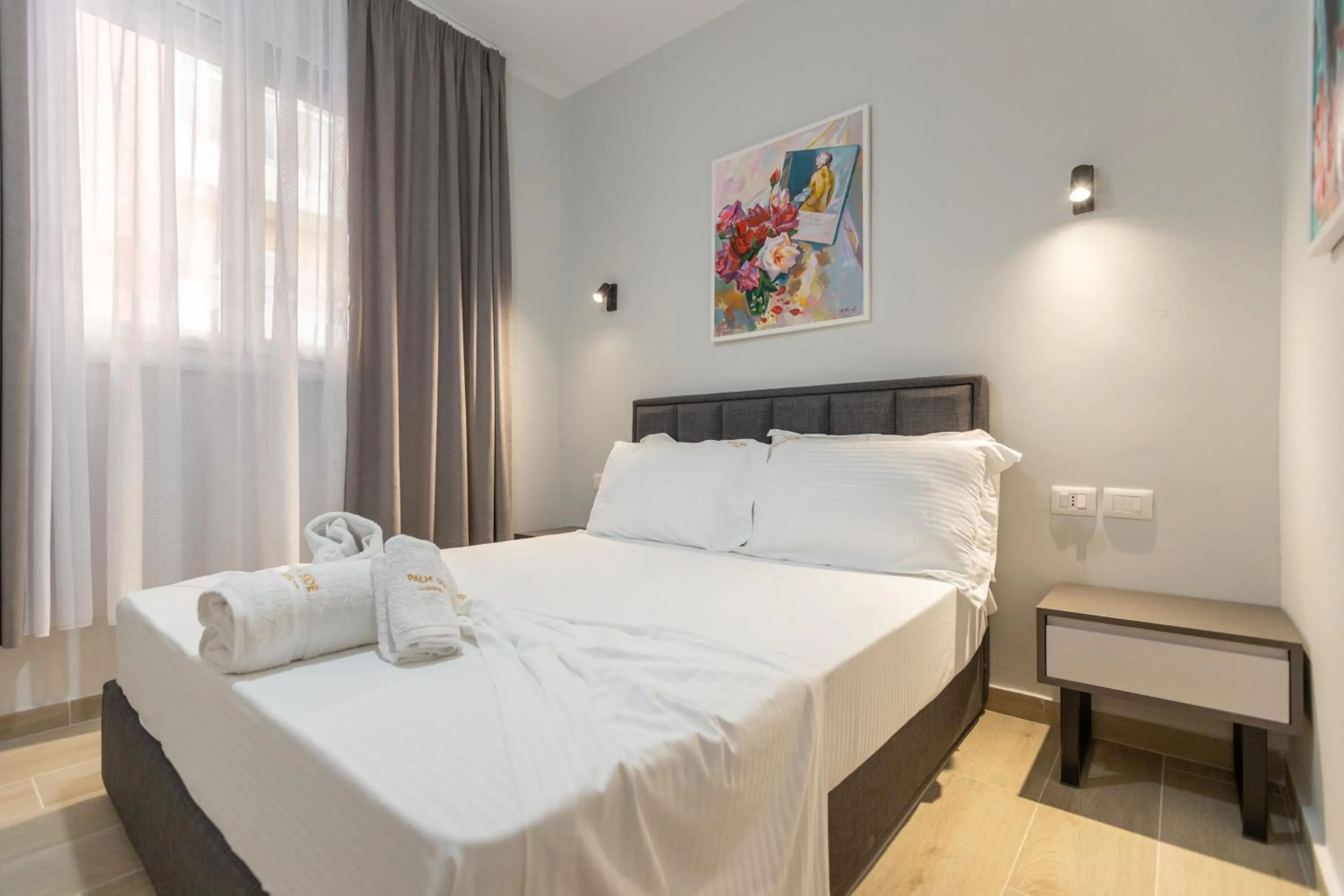 Bed in Palm Side Hotel