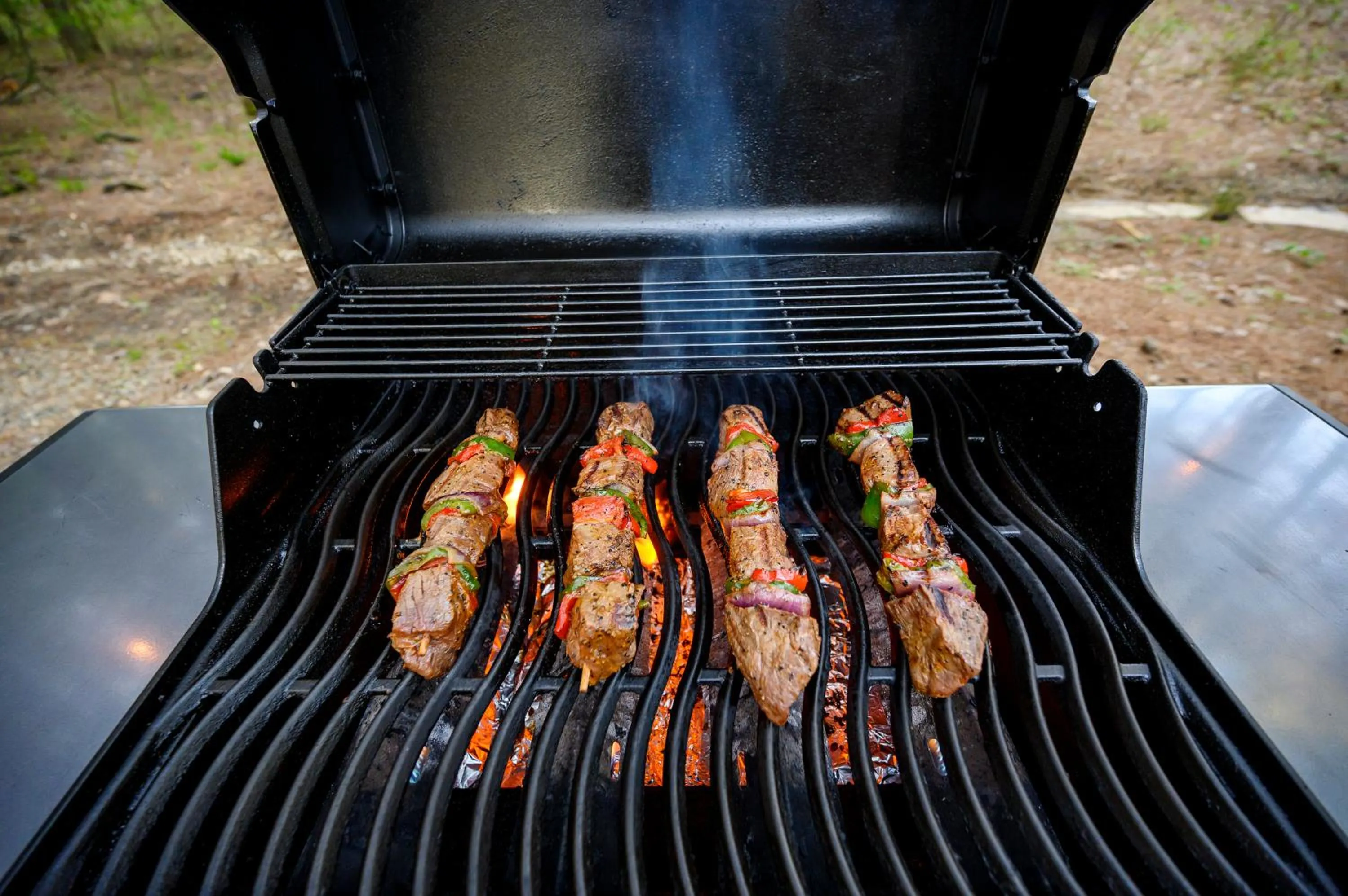 BBQ facilities in Hickory Bear - Cabin surrounded by pines, Sleeps 10, Hot Tub, Fire Pit, Arcade, Foosball Table & Deck Slide