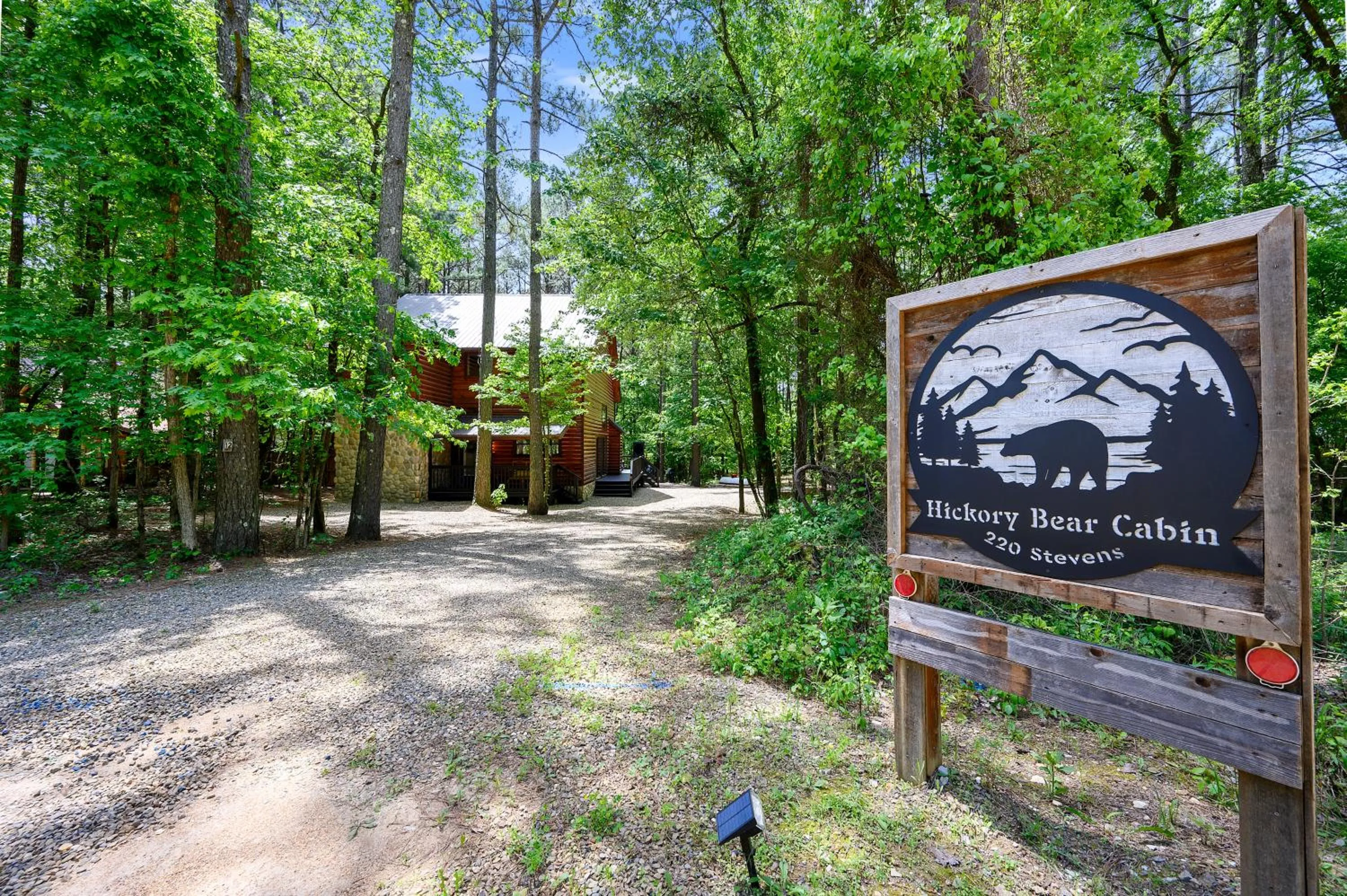Property logo or sign in Hickory Bear - Cabin surrounded by pines, Sleeps 10, Hot Tub, Fire Pit, Arcade, Foosball Table & Deck Slide