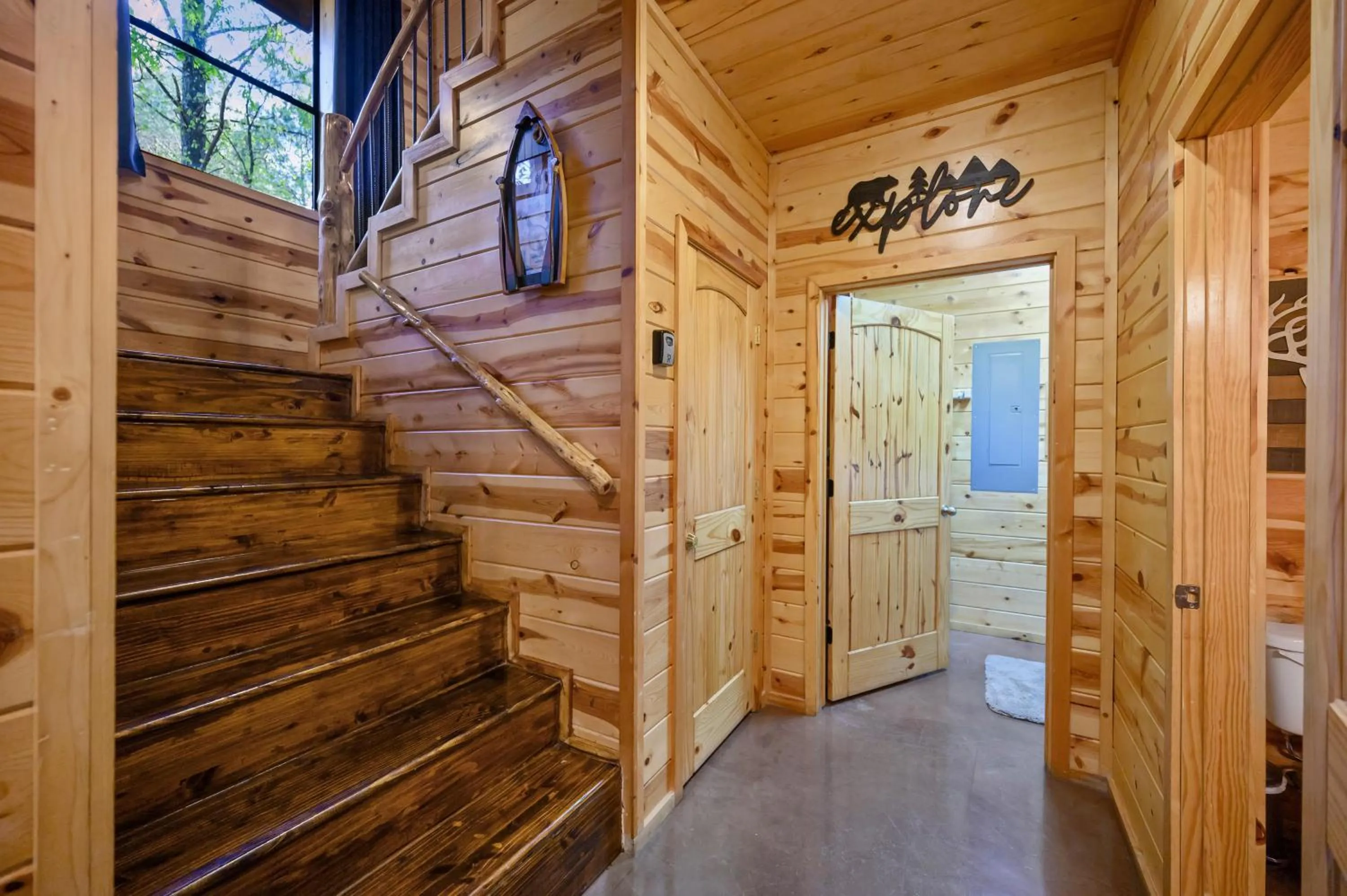 Property building in Hickory Bear - Cabin surrounded by pines, Sleeps 10, Hot Tub, Fire Pit, Arcade, Foosball Table & Deck Slide