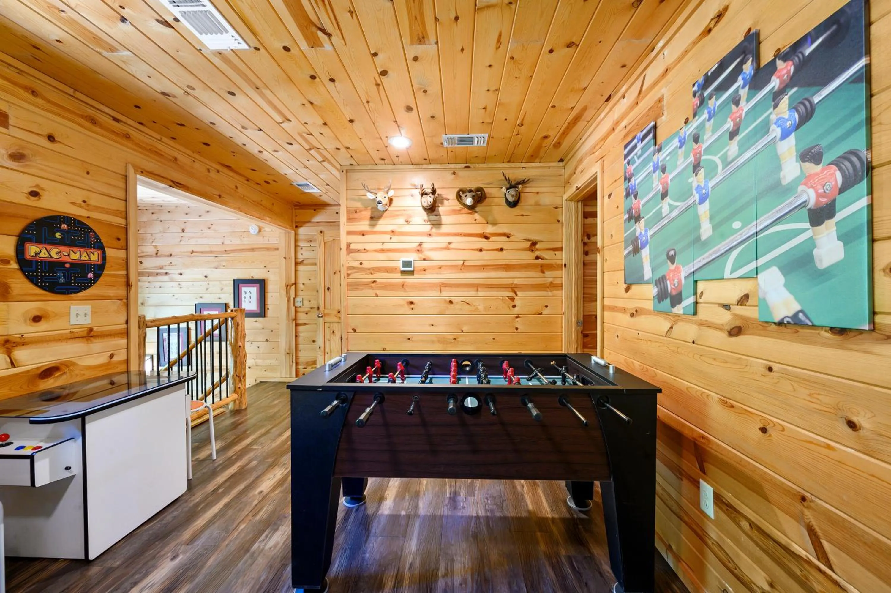 Game Room in Hickory Bear - Cabin surrounded by pines, Sleeps 10, Hot Tub, Fire Pit, Arcade, Foosball Table & Deck Slide