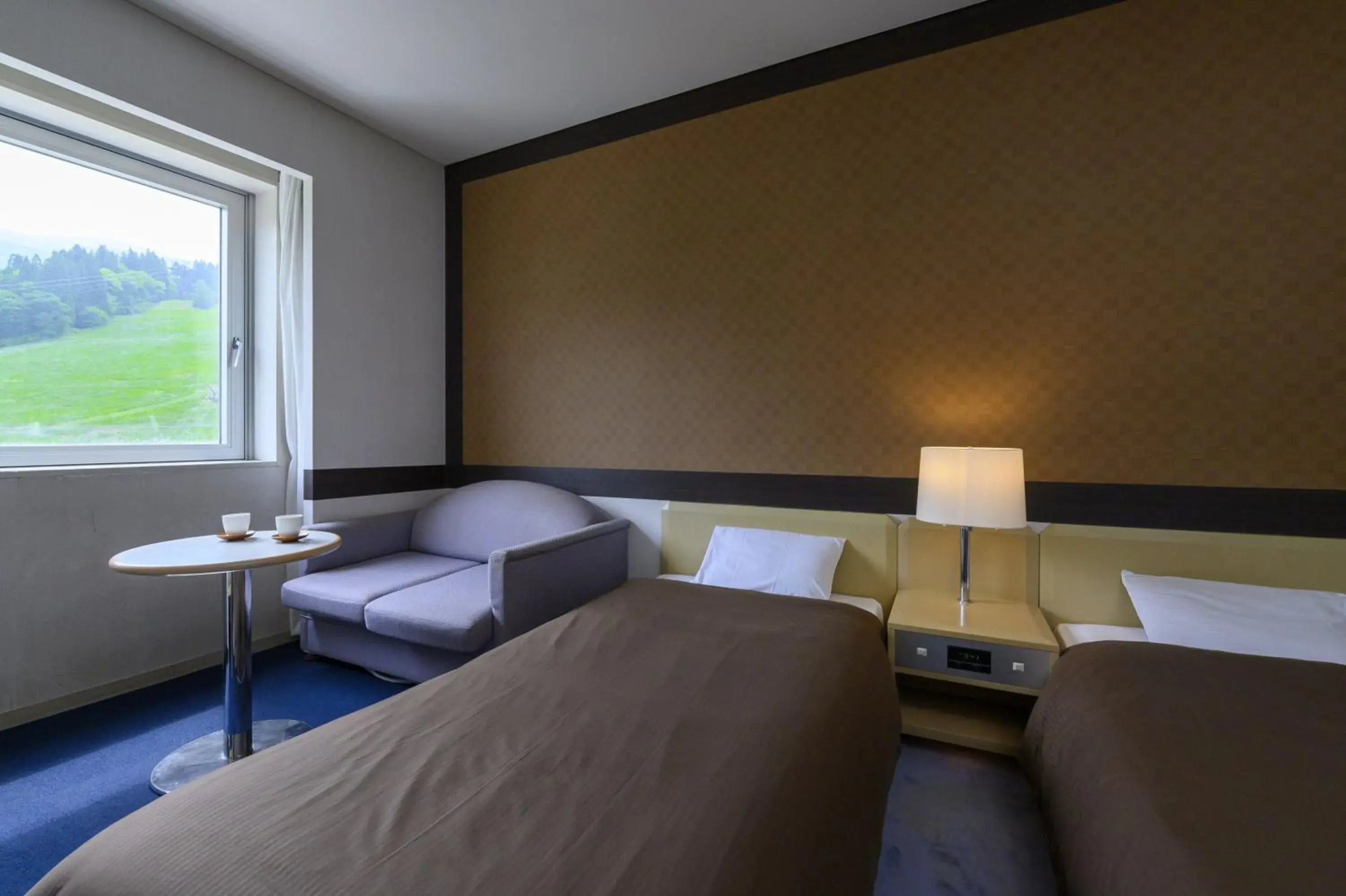 Bed in Takamiya Hotel Rurikura Resort Bed in Takamiya Hotel Rurikura Resort