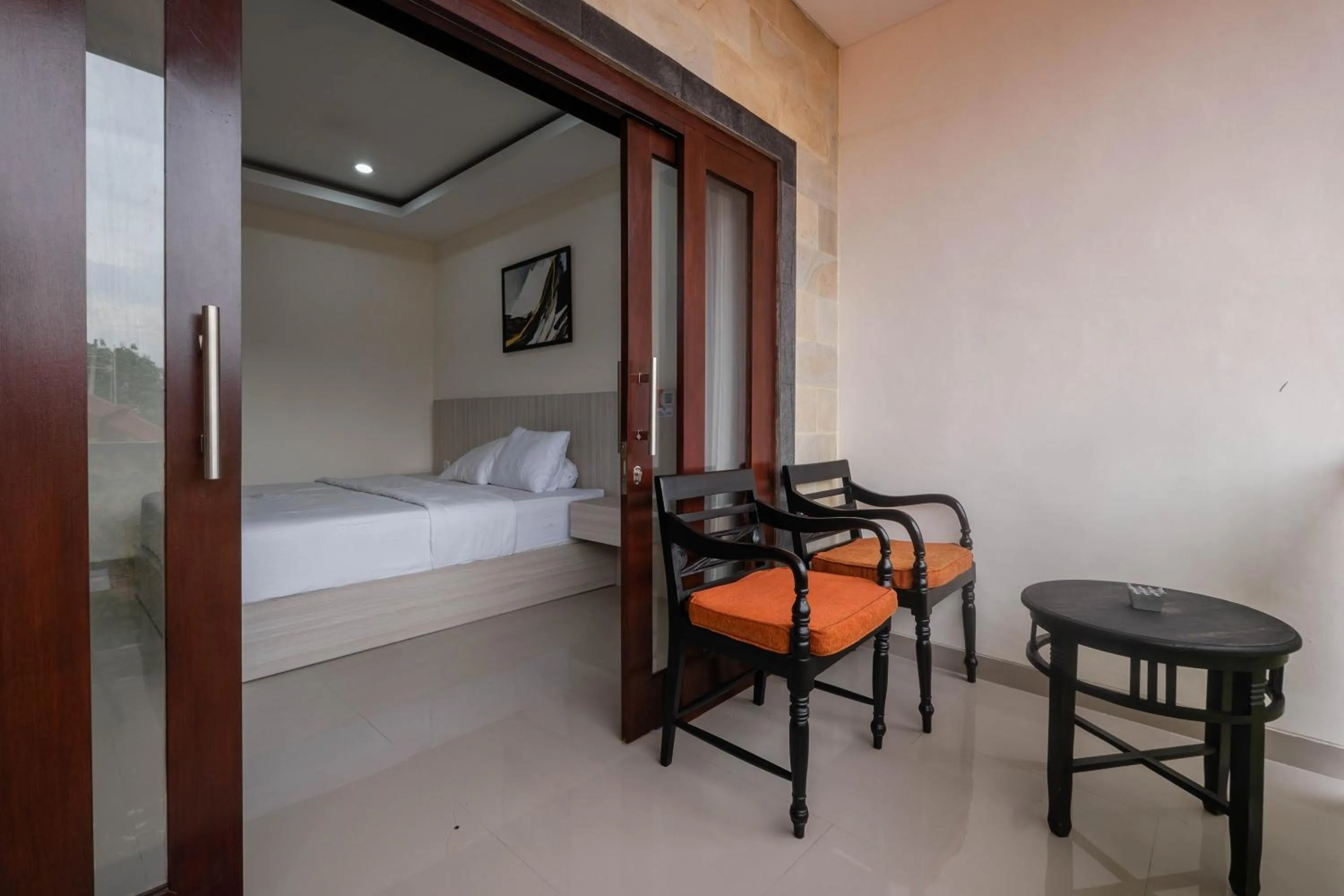 Seating area, Bed in Puri Kasih Home Stay