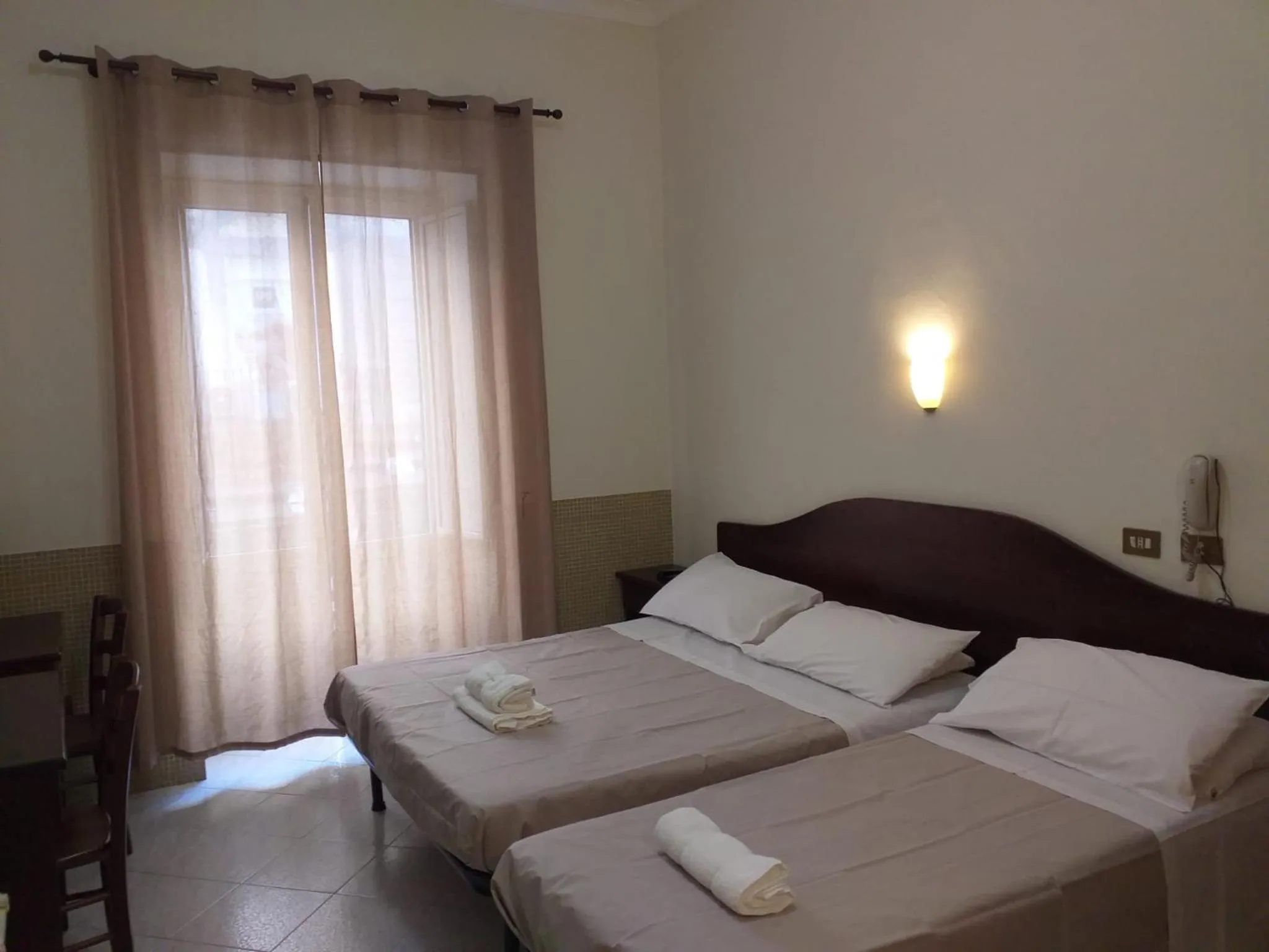 Photo of the whole room, Bed in Hotel Vittorio Veneto Napoli