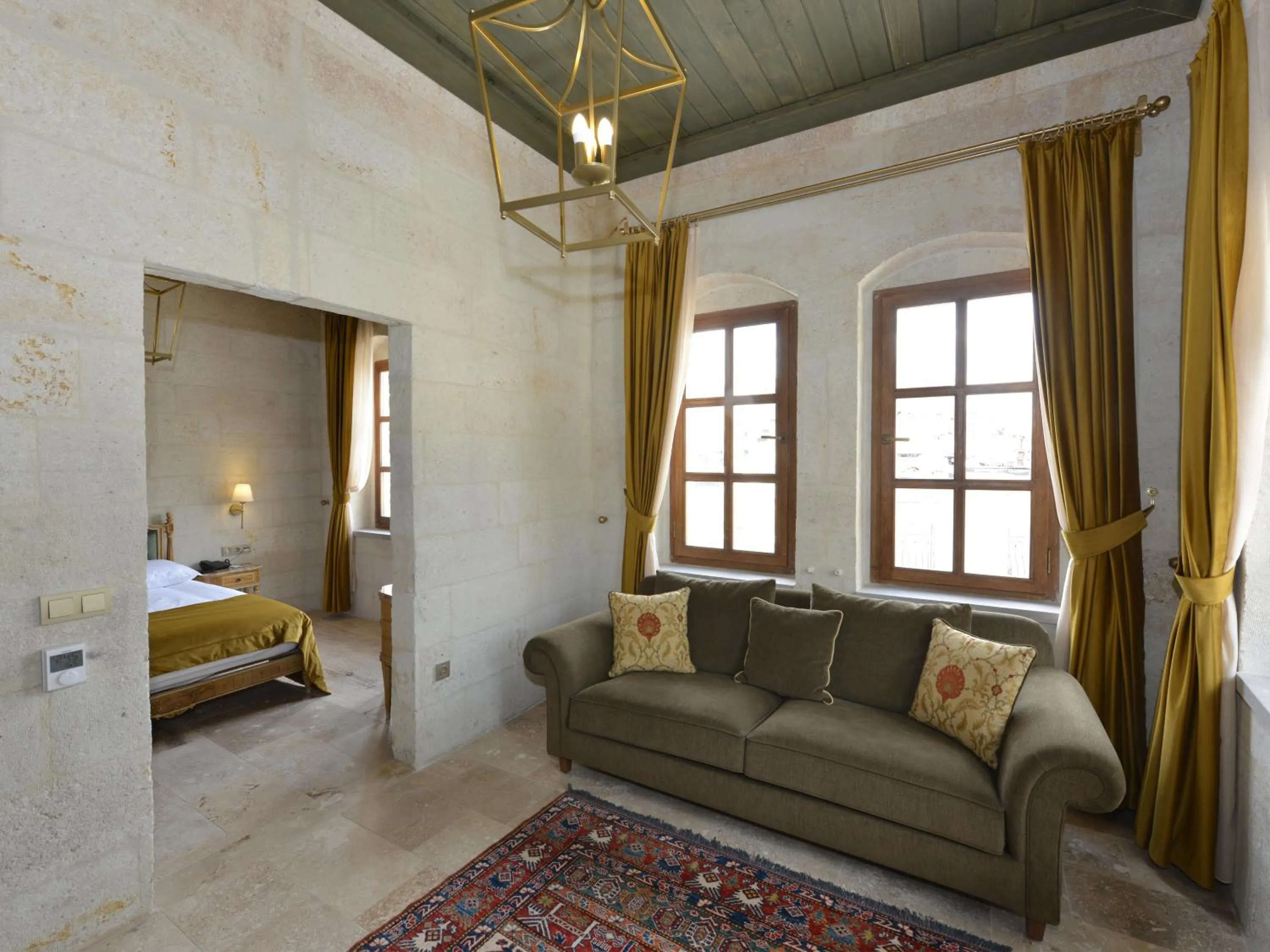 Living room, Bed in Evanthia Cave Suites - Special Class