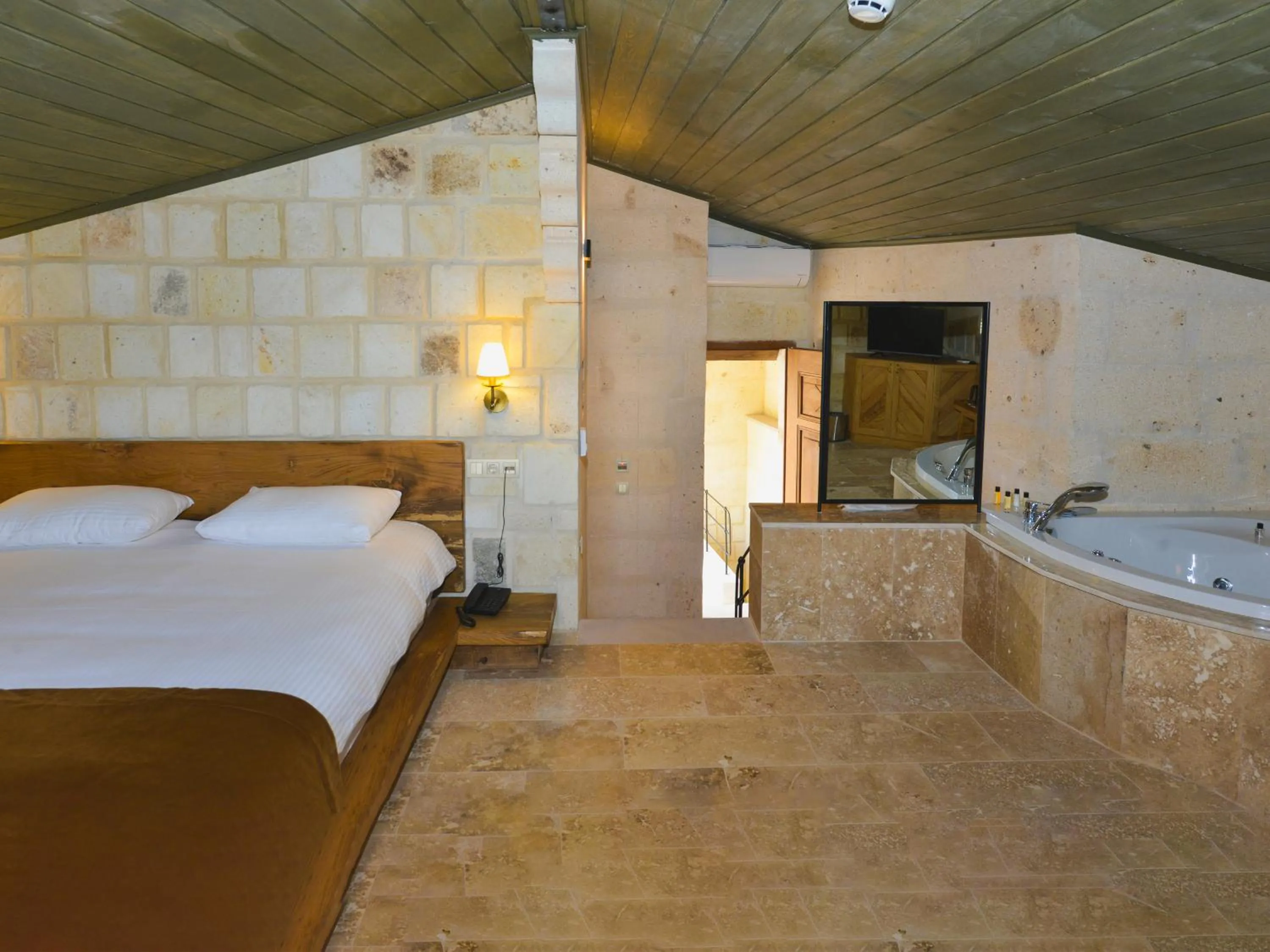 Bed in Evanthia Cave Suites - Special Class