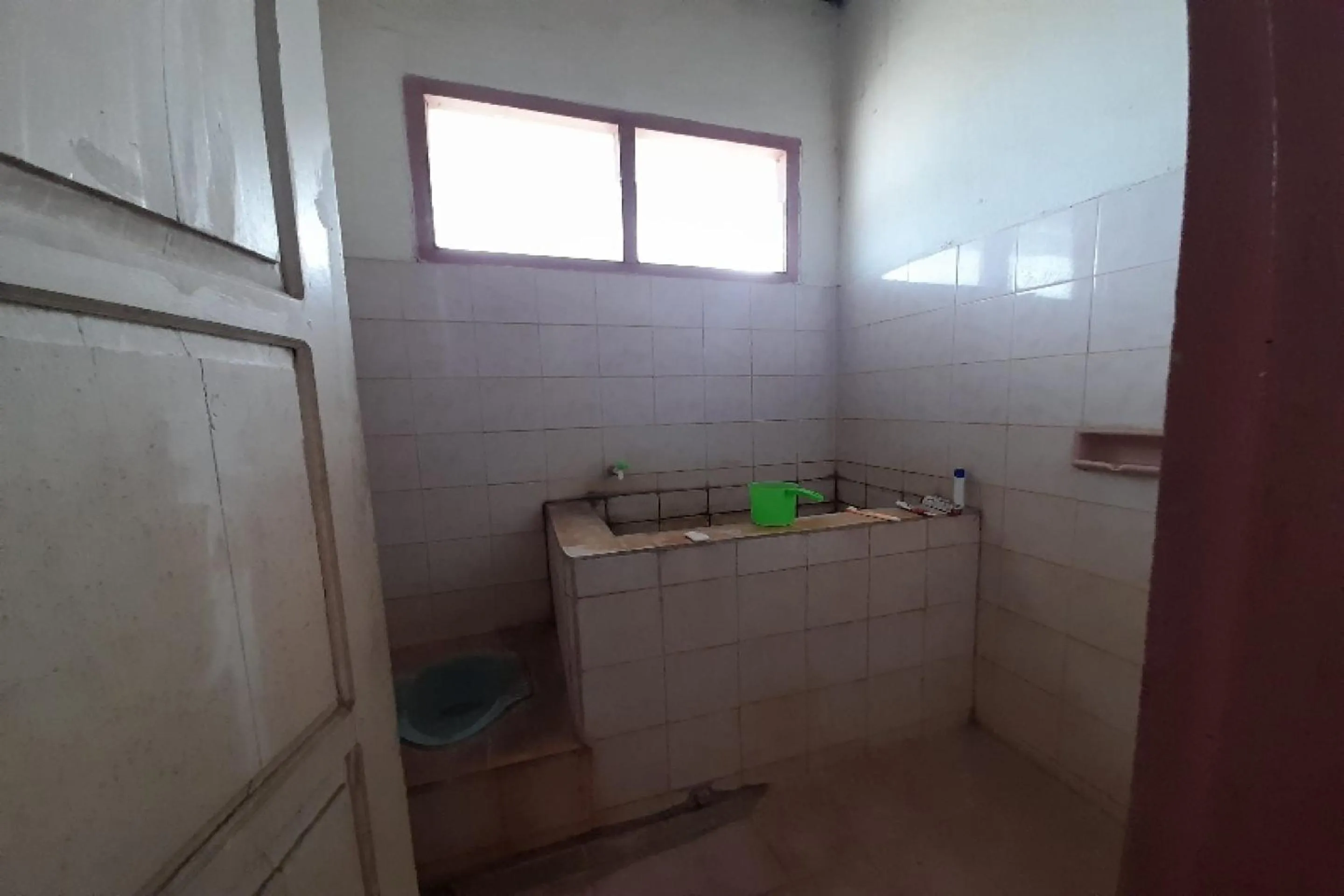Bathroom in OYO HOMES 91248 Desa Wisata Banding Agung Danau Ranau